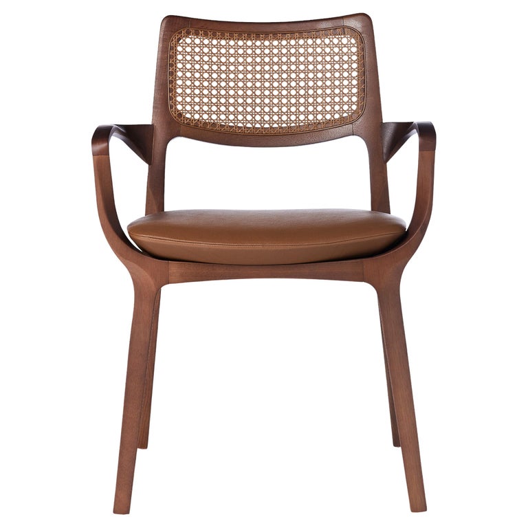 https://a.1stdibscdn.com/post-modern-style-aurora-chair-in-sculpted-walnut-finish-with-cane-and-leather-for-sale/f_35593/f_299044221659978134926/f_29904422_1659978136259_bg_processed.jpg?width=768