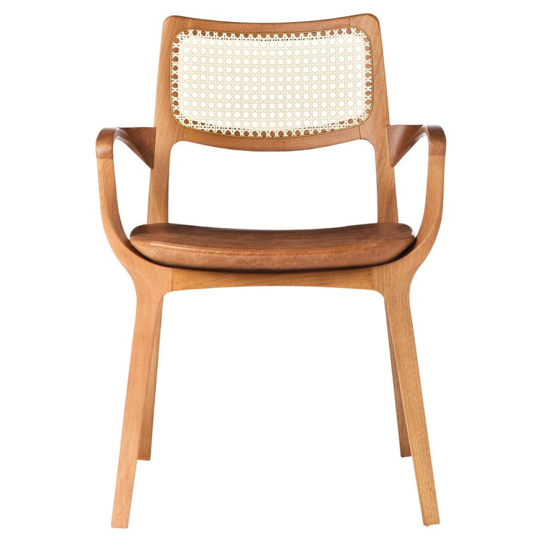https://a.1stdibscdn.com/post-modern-style-aurora-chair-in-sculpted-solid-wood-with-cane-back-and-leather-for-sale/f_35593/f_299051321659978697329/f_29905132_1659978698351_bg_processed.jpg?width=768