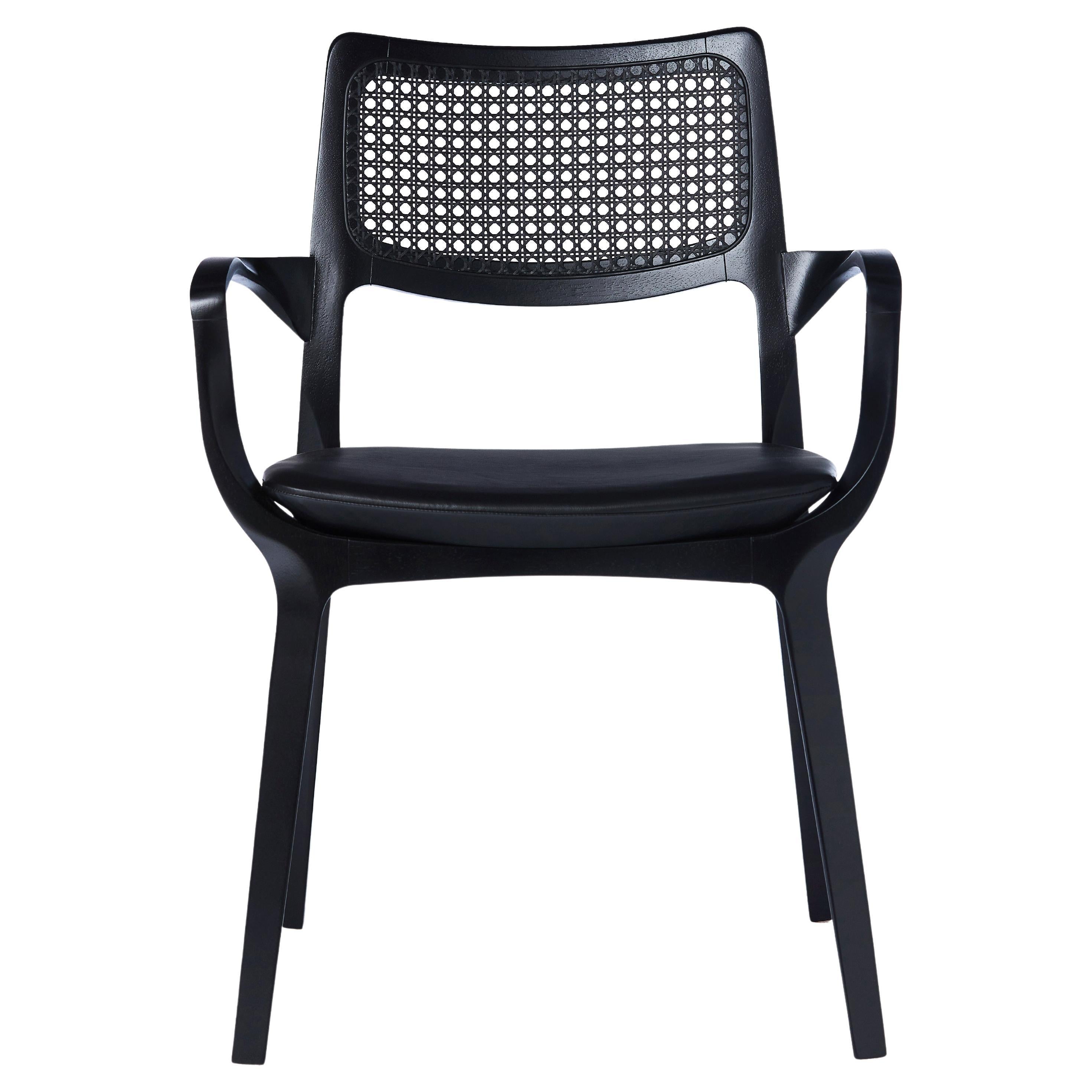 https://a.1stdibscdn.com/post-modern-style-aurora-chair-in-black-ebonized-with-cane-back-and-leather-for-sale/f_35593/f_299053921659979860854/f_29905392_1659979862016_bg_processed.jpg