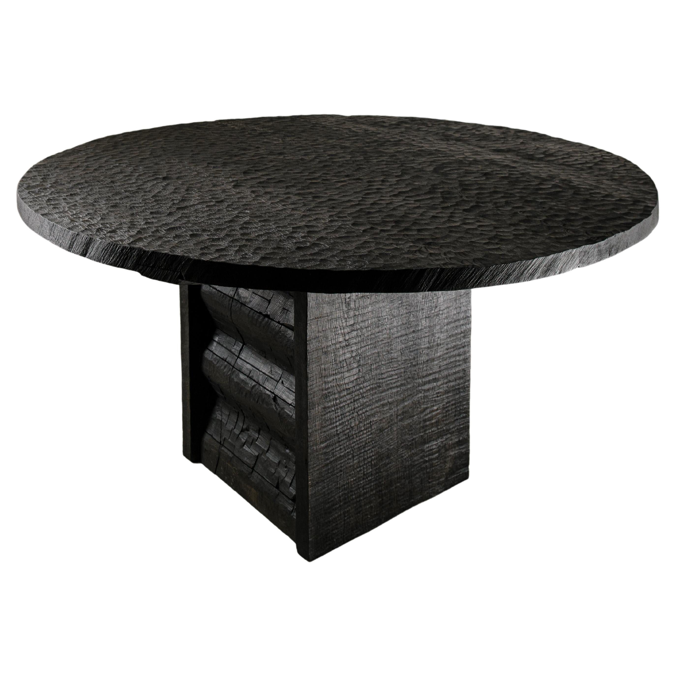 https://a.1stdibscdn.com/contemporary-carved-round-table-in-solid-oakwood-black-custom-size-m-for-sale/f_31233/f_301956621661865428826/f_30195662_1661865429857_bg_processed.jpg