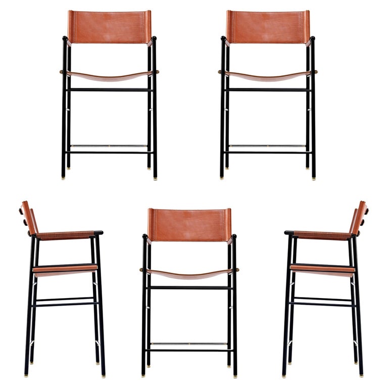 https://a.1stdibscdn.com/set-of-5-repose-counter-stool-w-backrest-natural-tan-saddle-black-rubbered-metal-for-sale/f_40561/f_303545021662719594019/f_30354502_1662719594786_bg_processed.jpg?width=768
