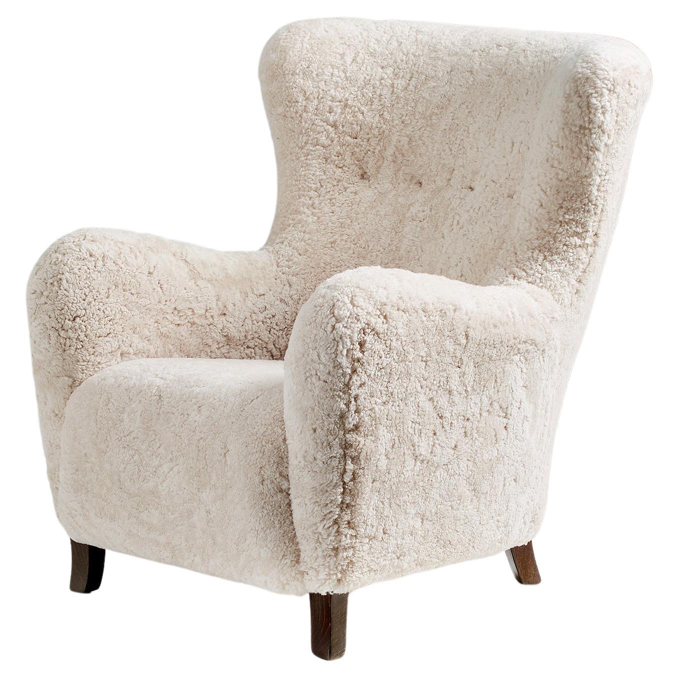 https://a.1stdibscdn.com/custom-made-sampo-sheepskin-wing-chair-for-sale/f_67442/f_306415521664530866550/f_30641552_1664530866985_bg_processed.jpg