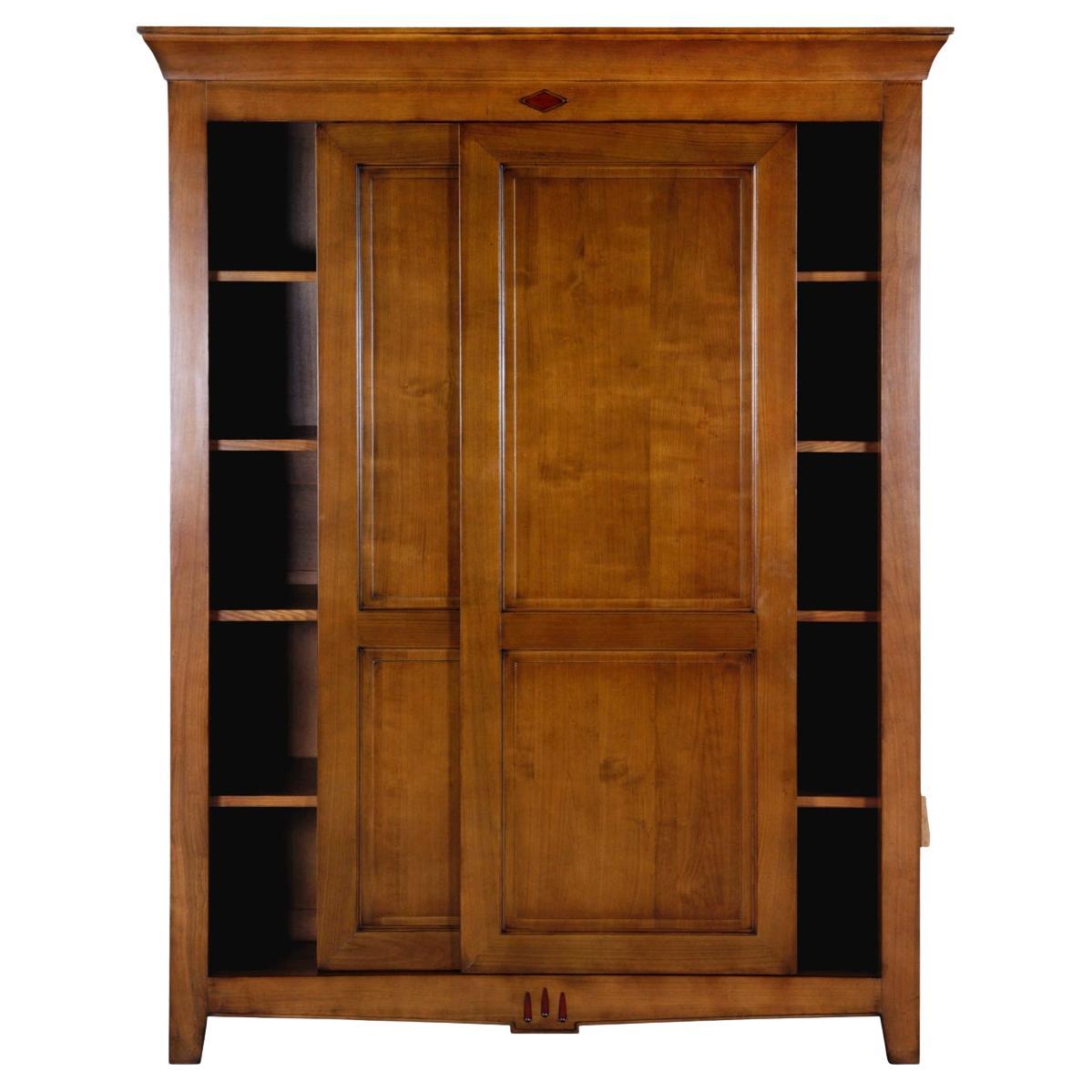 https://a.1stdibscdn.com/french-2-sliding-door-armoire-in-solid-cherry-classical-directoire-style-for-sale/f_57342/f_311760521667731795083/f_31176052_1667731795373_bg_processed.jpg