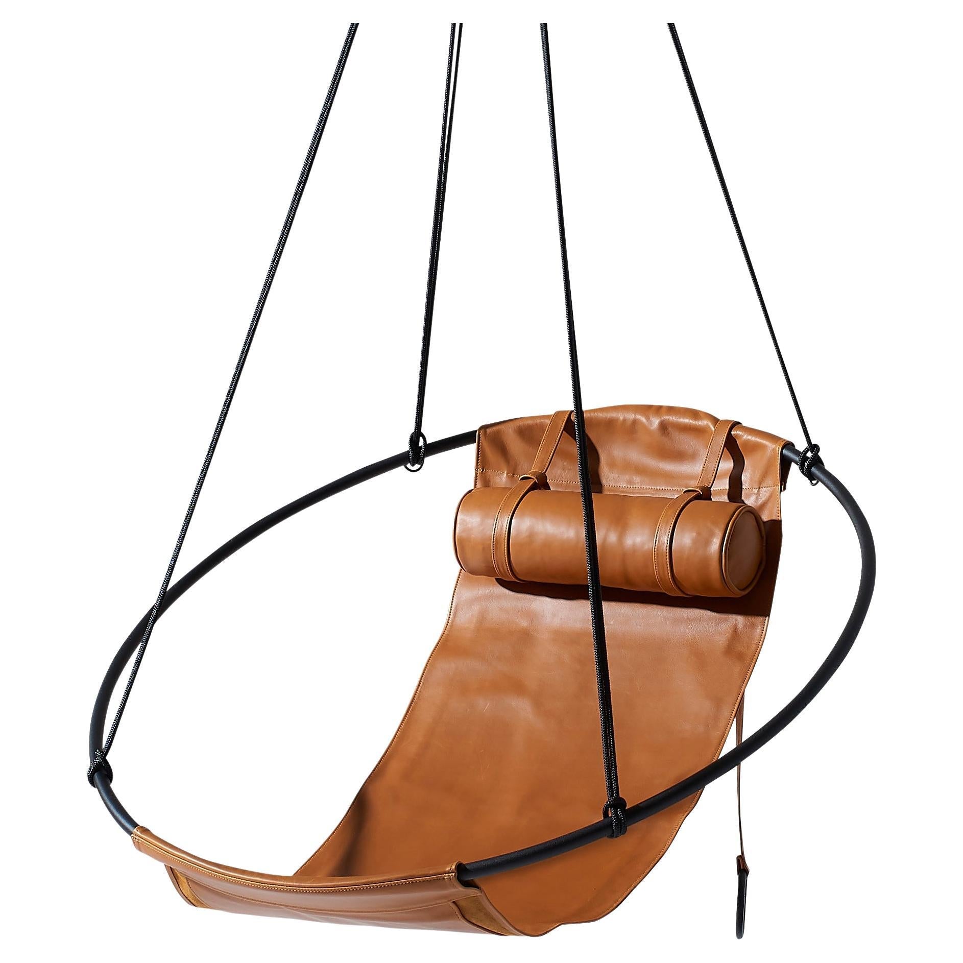 https://a.1stdibscdn.com/contemporary-genuine-leather-mild-steel-hanging-sling-chair-in-brown-ochre-for-sale/f_32773/f_312695521668169479067/f_31269552_1668169479669_bg_processed.jpg