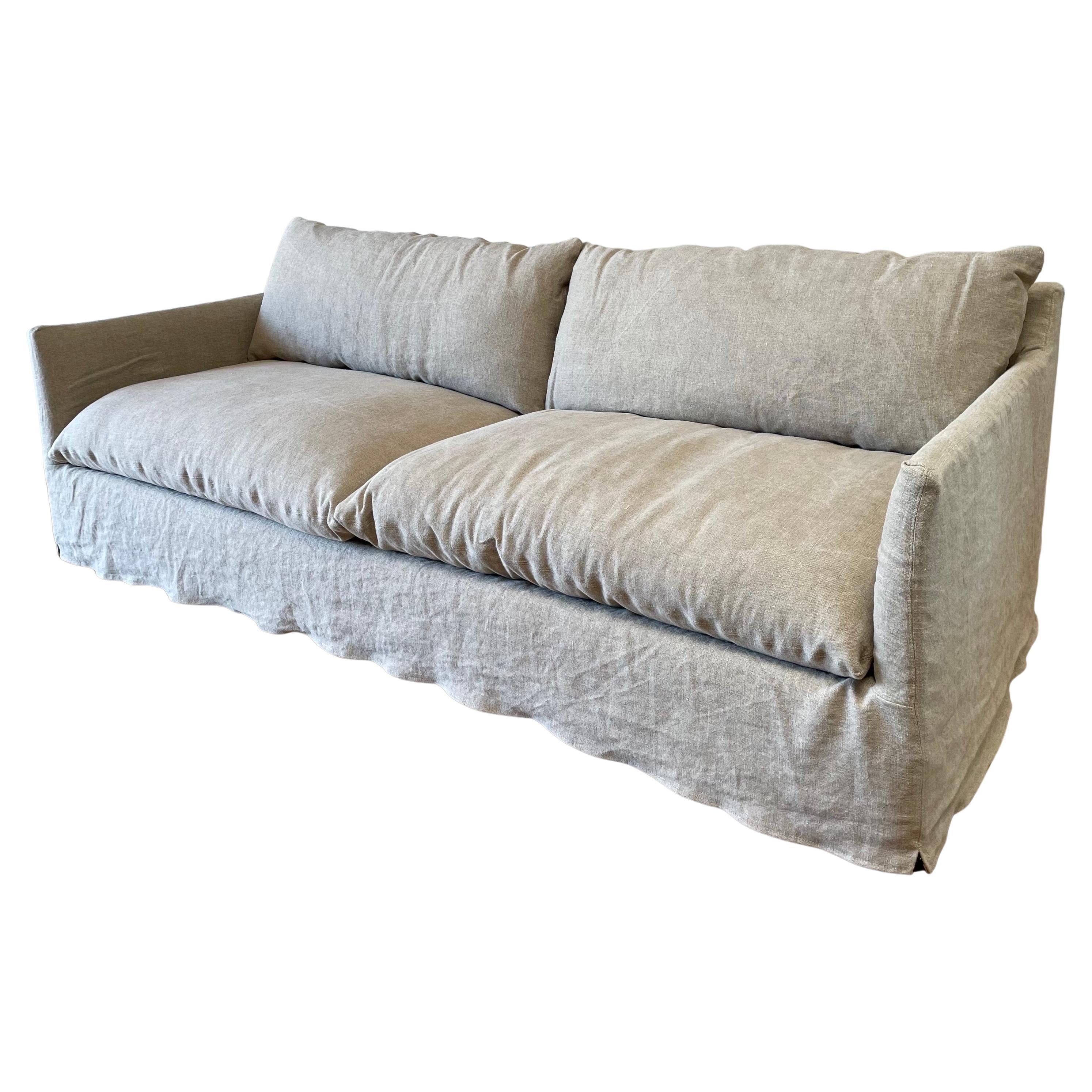 https://a.1stdibscdn.com/new-custom-stone-washed-irish-linen-slip-covered-sofa-with-down-alt-cushions-for-sale/f_18223/f_315029321669747059853/f_31502932_1669747061207_bg_processed.jpg