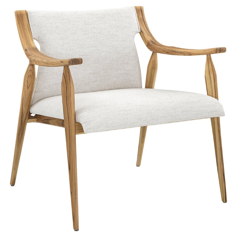 https://a.1stdibscdn.com/mince-armchair-featuring-curved-arms-and-spindle-legs-in-teak-for-sale/f_52822/f_329319821677161341102/f_32931982_1677161342015_bg_processed.jpg?width=768