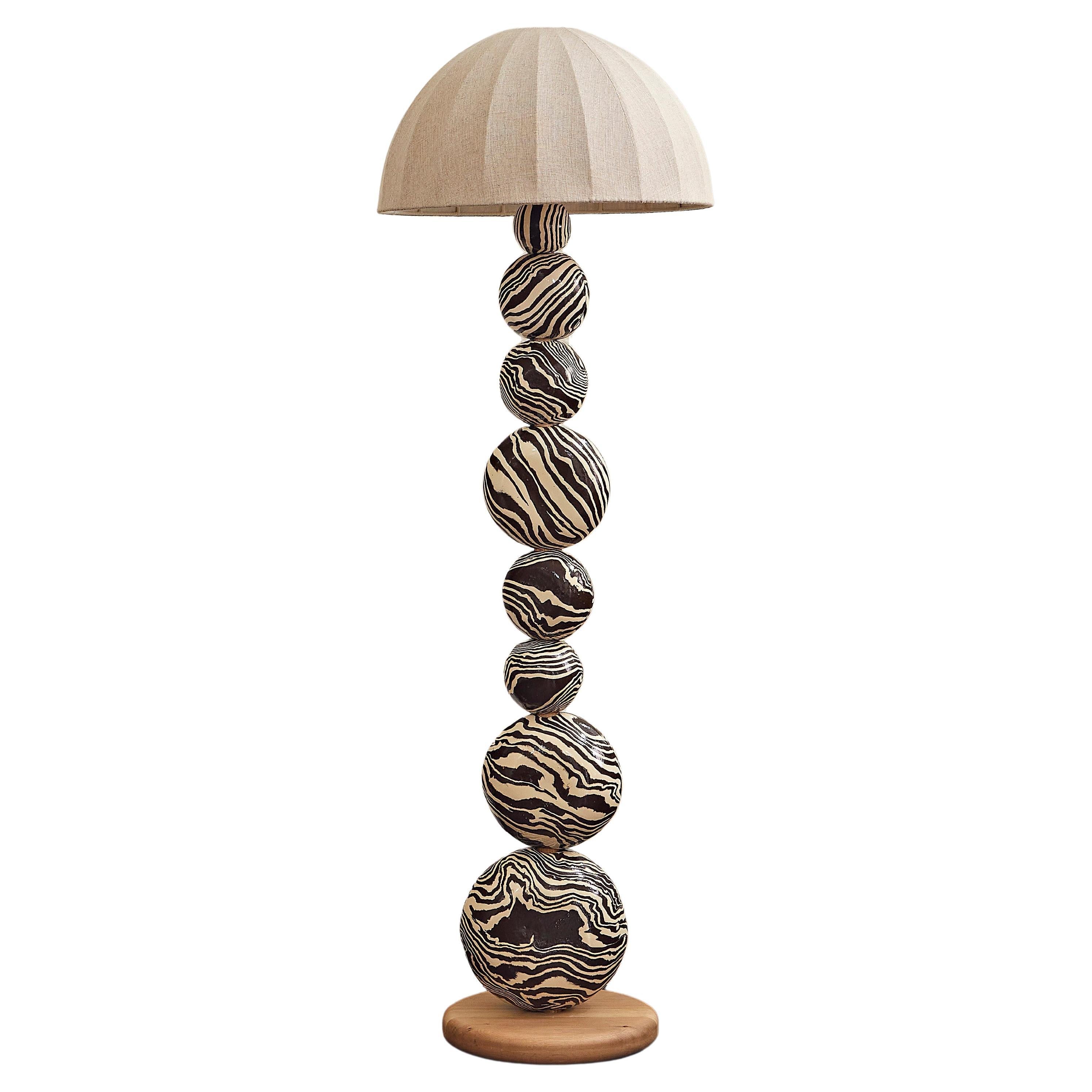 https://a.1stdibscdn.com/henry-holland-studio-handmade-brown-and-white-ceramic-sphere-floor-lamp-for-sale/f_82792/f_333466221681393603215/f_33346622_1681393604078_bg_processed.jpg