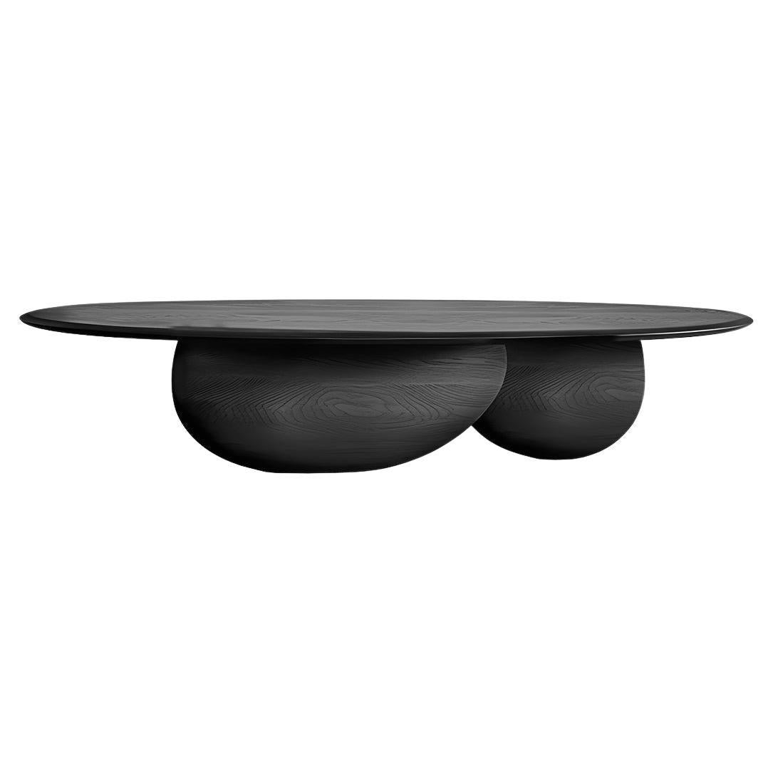 https://a.1stdibscdn.com/solid-wood-black-tinted-coffee-table-fishes-series-9-by-joel-escalona-for-sale/f_39563/f_338097821681486586058/f_33809782_1681486586286_bg_processed.jpg