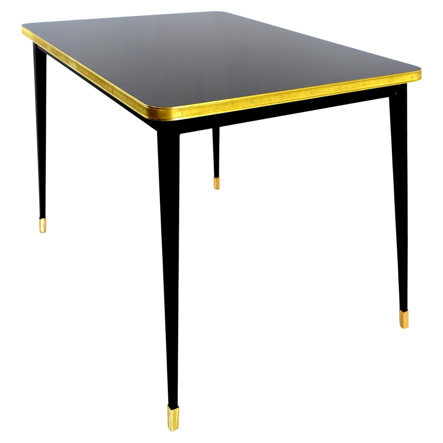https://a.1stdibscdn.com/rectangular-table-high-gloss-top-brass-framed-black-conic-legs-brass-end-xlarge-for-sale/f_40561/f_338247221681550498268/f_33824302_1681547896105_bg_processed.jpg