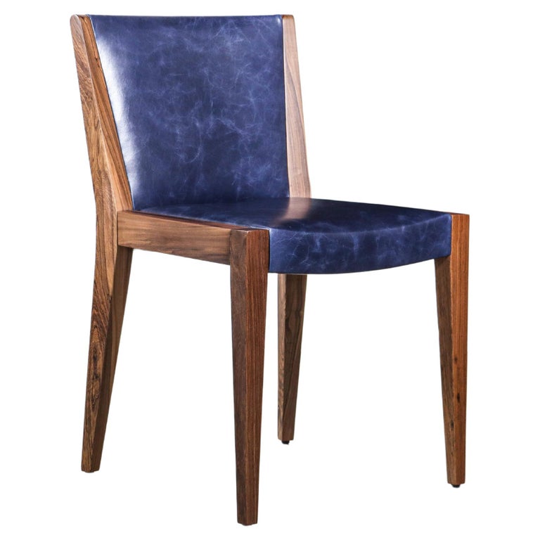 https://a.1stdibscdn.com/modern-exotic-wood-and-wrapped-leather-dining-chair-from-costantini-giovanni-for-sale/f_25173/f_339900321682508026647/f_33990032_1682508027133_bg_processed.jpg?width=768