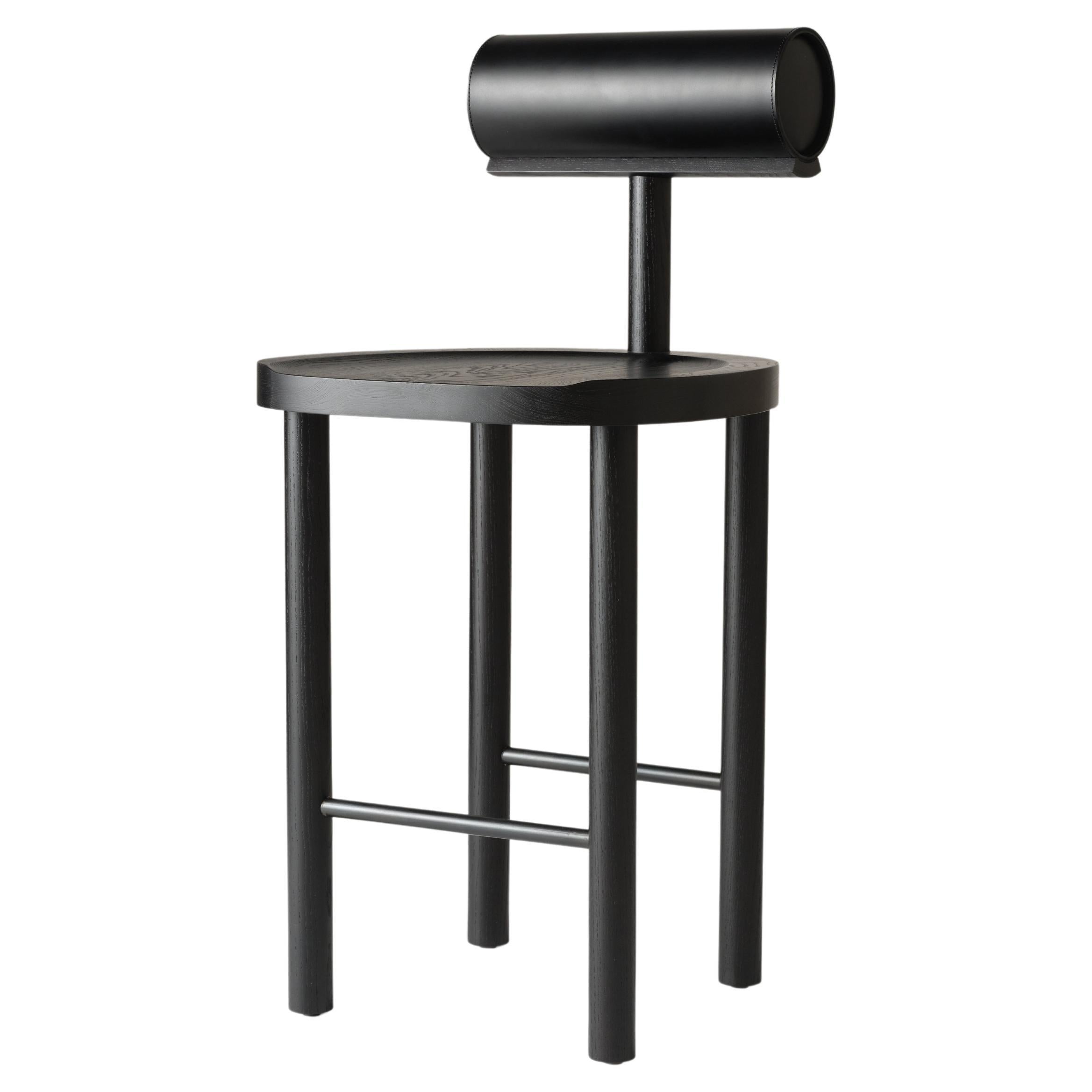 https://a.1stdibscdn.com/una-counter-stool-in-black-stained-ash-and-upholstered-back-by-estudio-persona-for-sale/f_23783/f_349654421687802674201/f_34965442_1687802674790_bg_processed.jpg