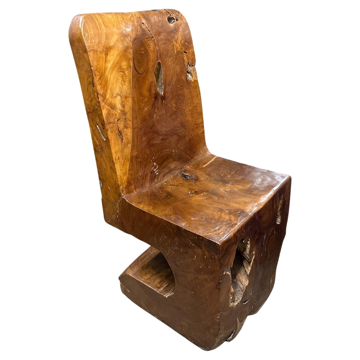 https://a.1stdibscdn.com/andrianna-shamaris-sculptural-teak-wood-chair-for-sale/f_10806/f_351413621688837423153/f_35141362_1688837423578_bg_processed.jpg