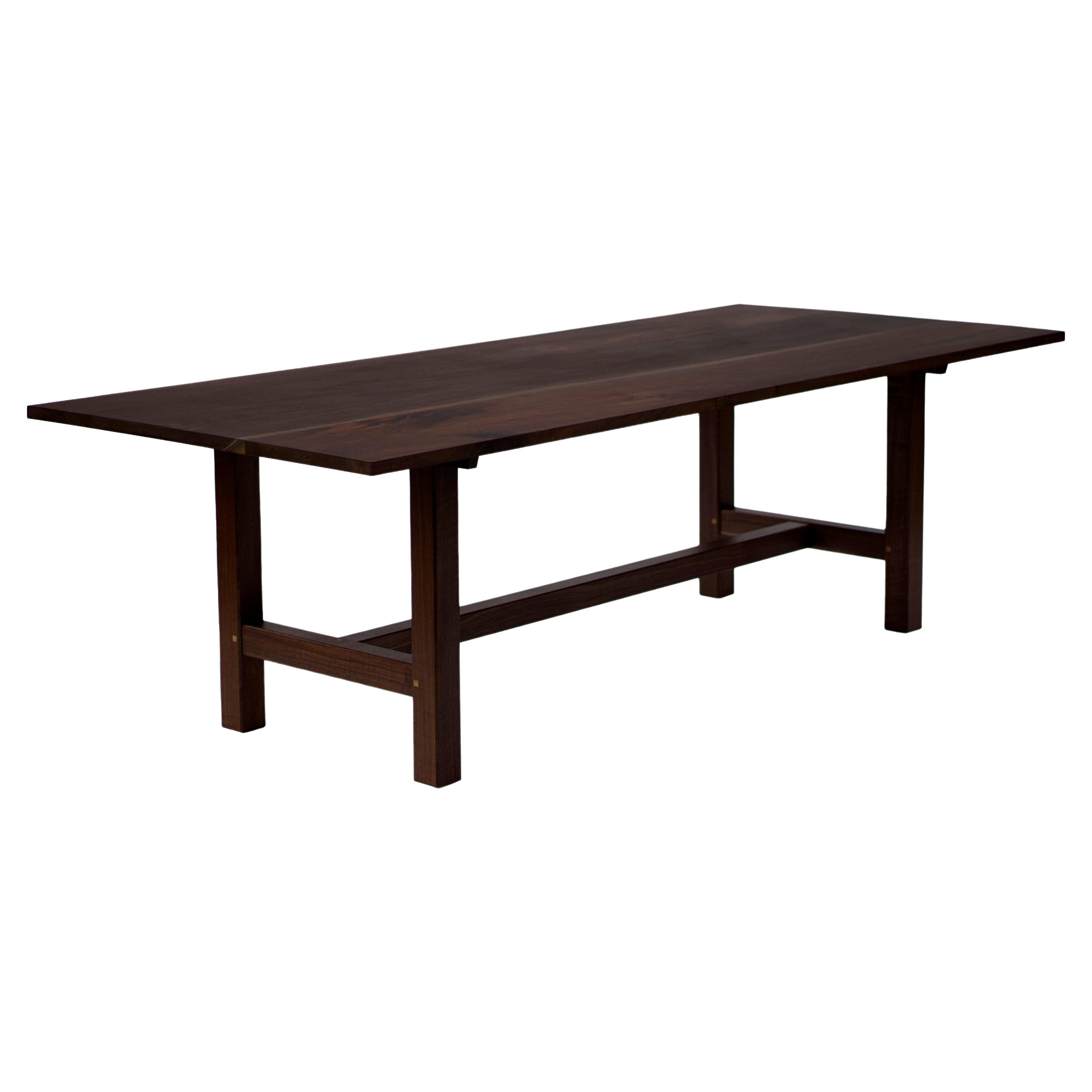 https://a.1stdibscdn.com/trestle-leg-dining-table-in-oiled-walnut-for-sale/f_45782/f_356936921691943161484/f_35693692_1691943162736_bg_processed.jpg