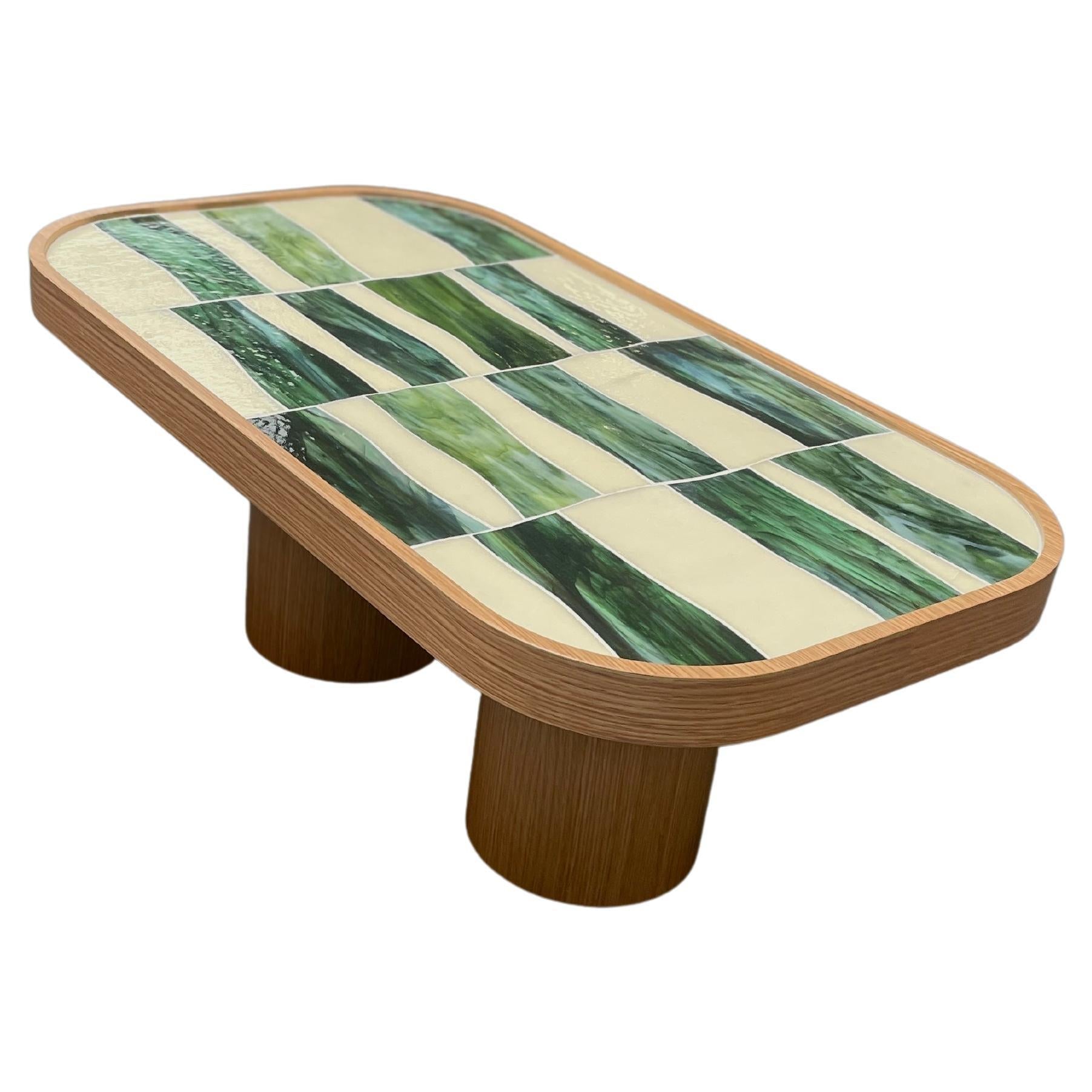 https://a.1stdibscdn.com/modern-oval-coffee-table-in-oak-wood-cylinder-base-and-glass-by-ercole-home-for-sale/f_42371/f_362106021695060041340/f_36210602_1695060041903_bg_processed.jpg