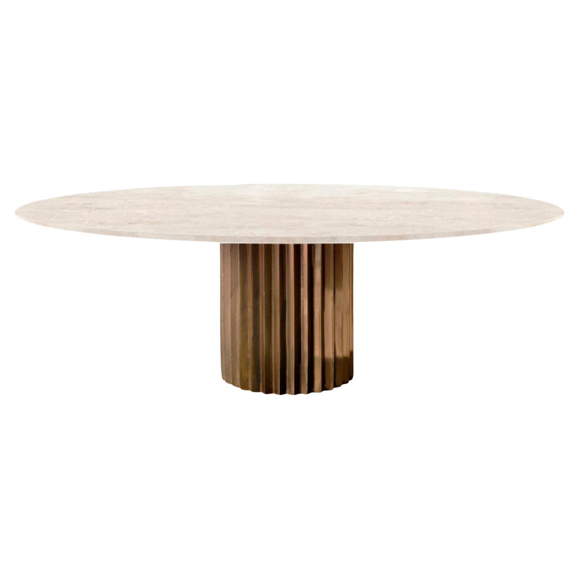https://a.1stdibscdn.com/doris-oval-pedestal-dining-table-in-travertine-and-cast-bronze-by-fredjuul-for-sale/f_22063/f_373005221701260540690/f_37300522_1701260541107_bg_processed.jpg