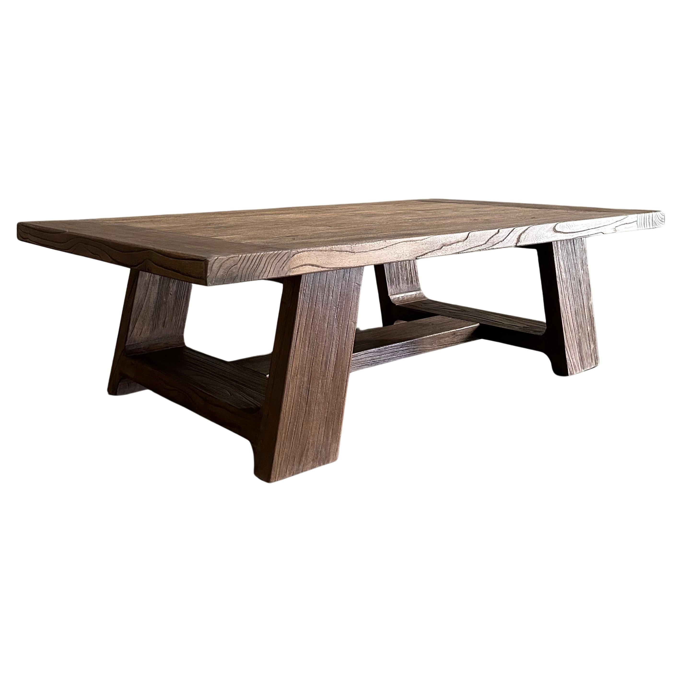 https://a.1stdibscdn.com/reclaimed-elm-wood-coffee-table-in-walnut-finish-for-sale/f_18223/f_468886121759354741993/f_37603502_1704408189565_bg_processed.jpg