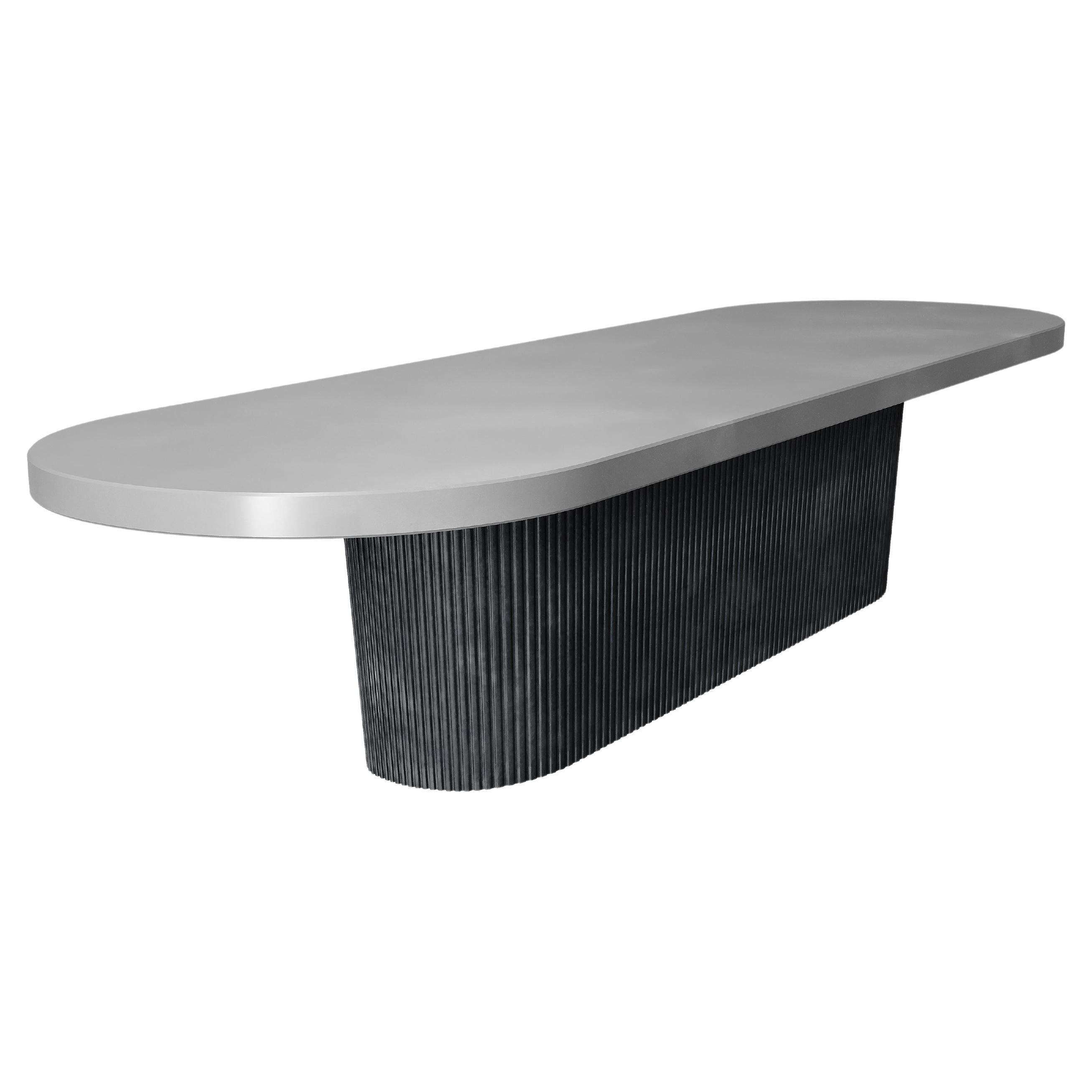 https://a.1stdibscdn.com/brutal-monolith-outdoor-concrete-dining-table-in-black-grey-finish-for-sale/f_27693/f_376472521703019639487/f_37647252_1703019640162_bg_processed.jpg