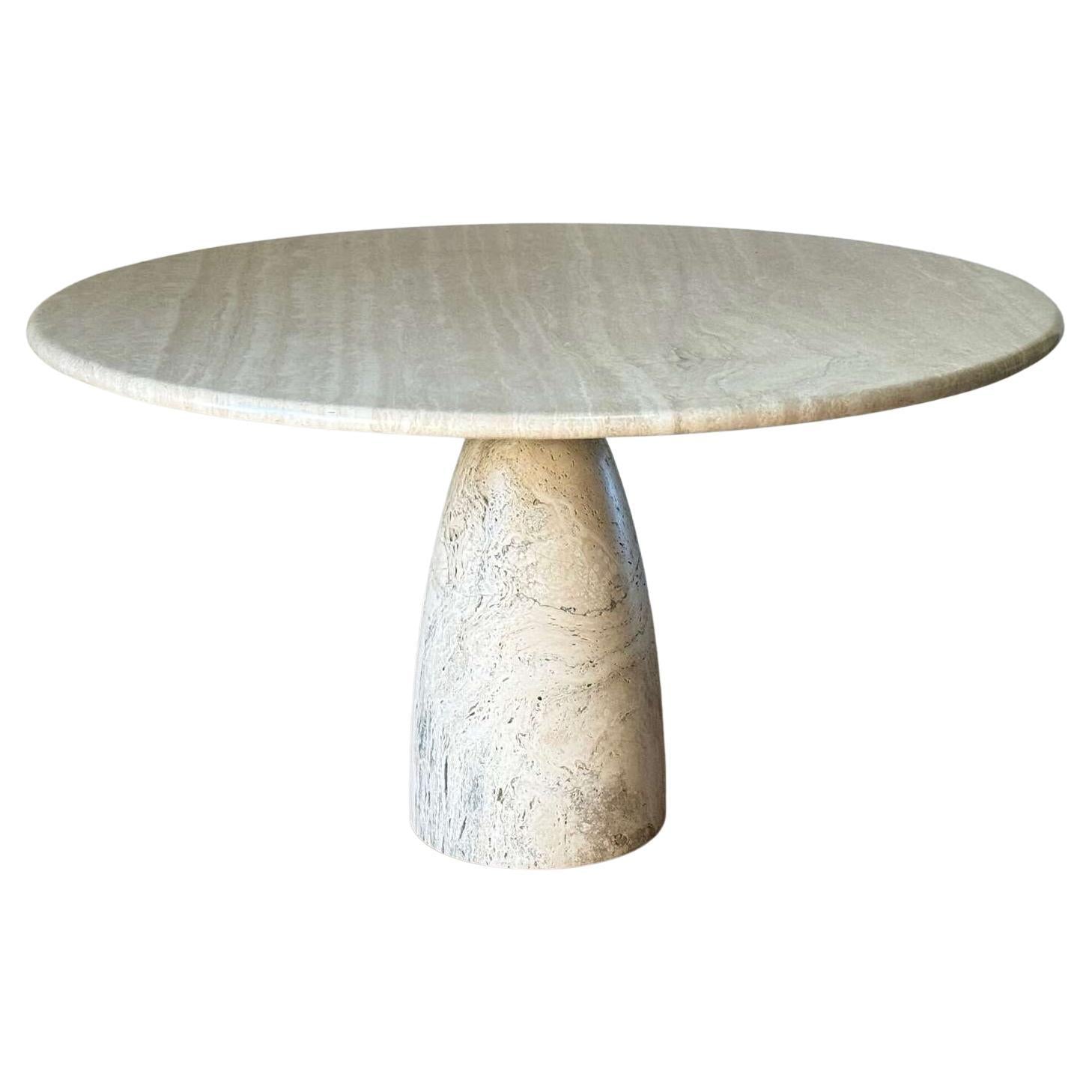 https://a.1stdibscdn.com/cream-travertine-round-dining-table-in-the-style-of-1970-angelo-mangiarotti-for-sale/f_80522/f_387595821773676164337/f_38759582_1773676164616_bg_processed.jpg