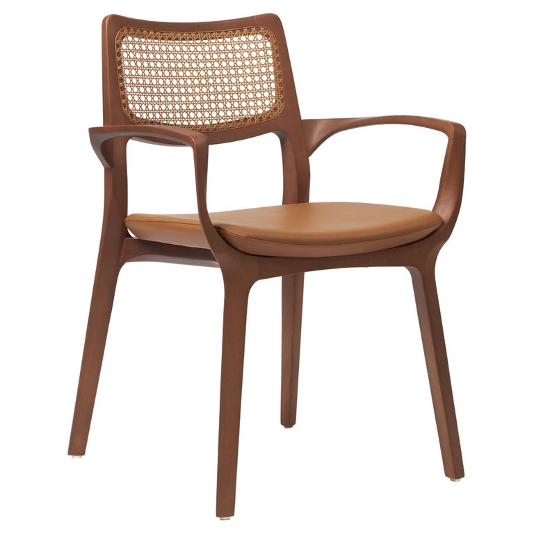 https://a.1stdibscdn.com/modern-style-aurora-chair-sculpted-in-walnut-finish-arms-leather-seating-cane-for-sale/f_35593/f_390205621711486959284/f_39020562_1711486960164_bg_processed.jpg?width=768