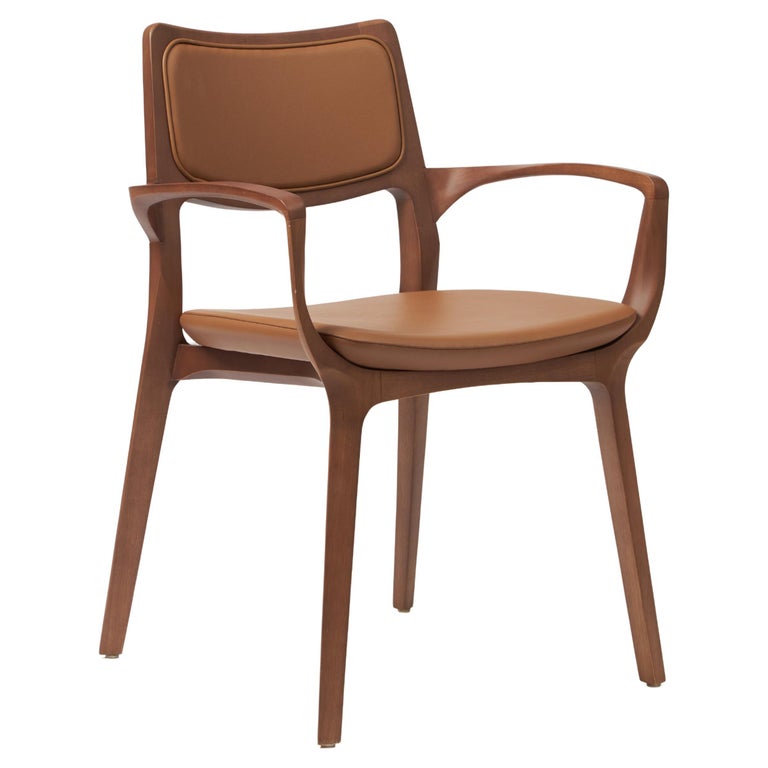 https://a.1stdibscdn.com/modern-style-aurora-chair-sculpted-in-walnut-finish-arms-leather-back-seating-for-sale/f_35593/f_390206321711487512324/f_39020632_1711487513153_bg_processed.jpg?width=768