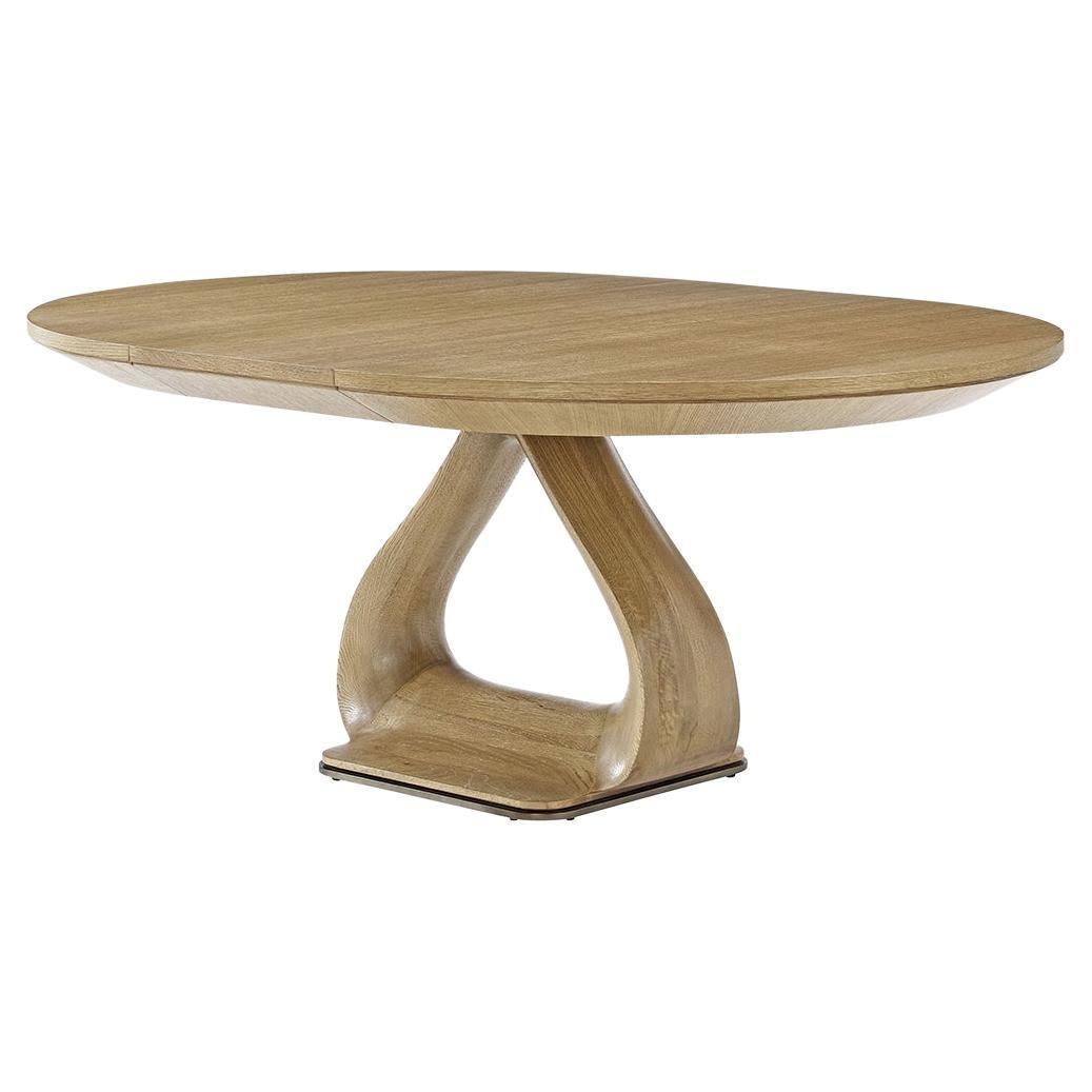 https://a.1stdibscdn.com/organic-modern-round-oak-extending-dining-table-for-sale/f_8038/f_395997321715039476655/f_39599732_1715039476893_bg_processed.jpg