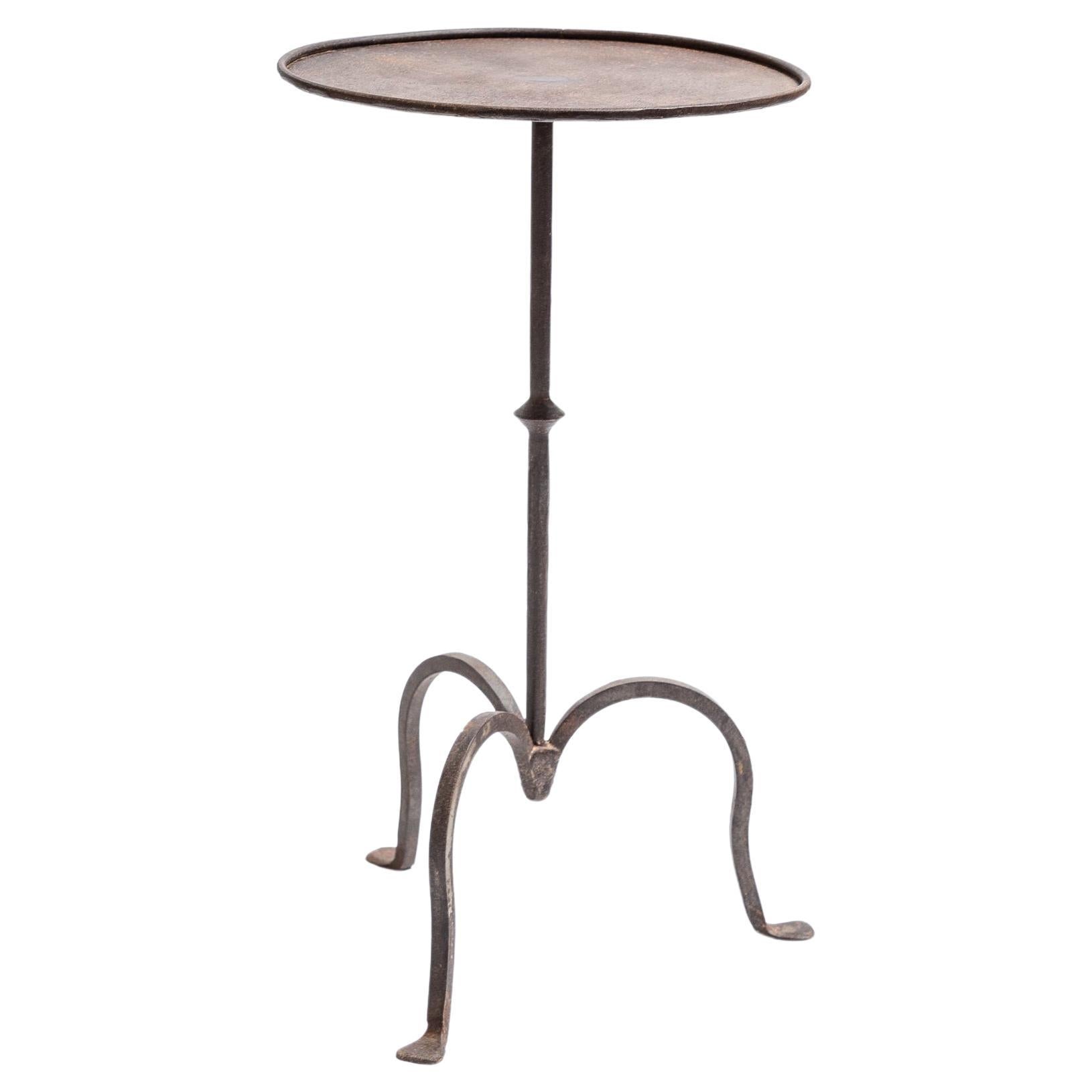 https://a.1stdibscdn.com/wrought-iron-martini-table-large-for-sale/f_76442/f_397119221715700583584/f_39711922_1715700583995_bg_processed.jpg