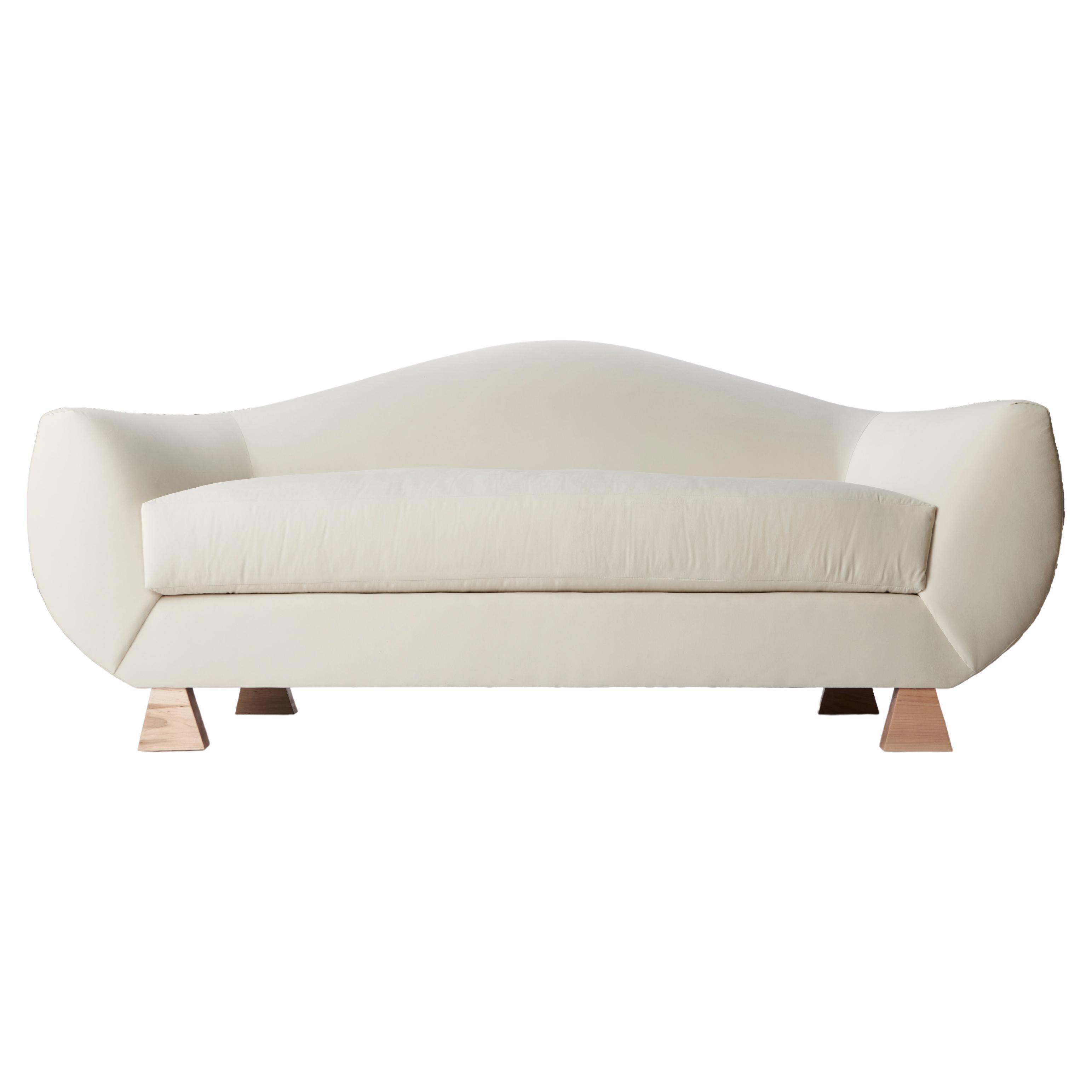 https://a.1stdibscdn.com/layton-curve-sofa-velvet-natural-wood-sofa-by-christian-siriano-for-sale/f_56972/f_397293321715787652640/f_39729332_1715787653612_bg_processed.jpg