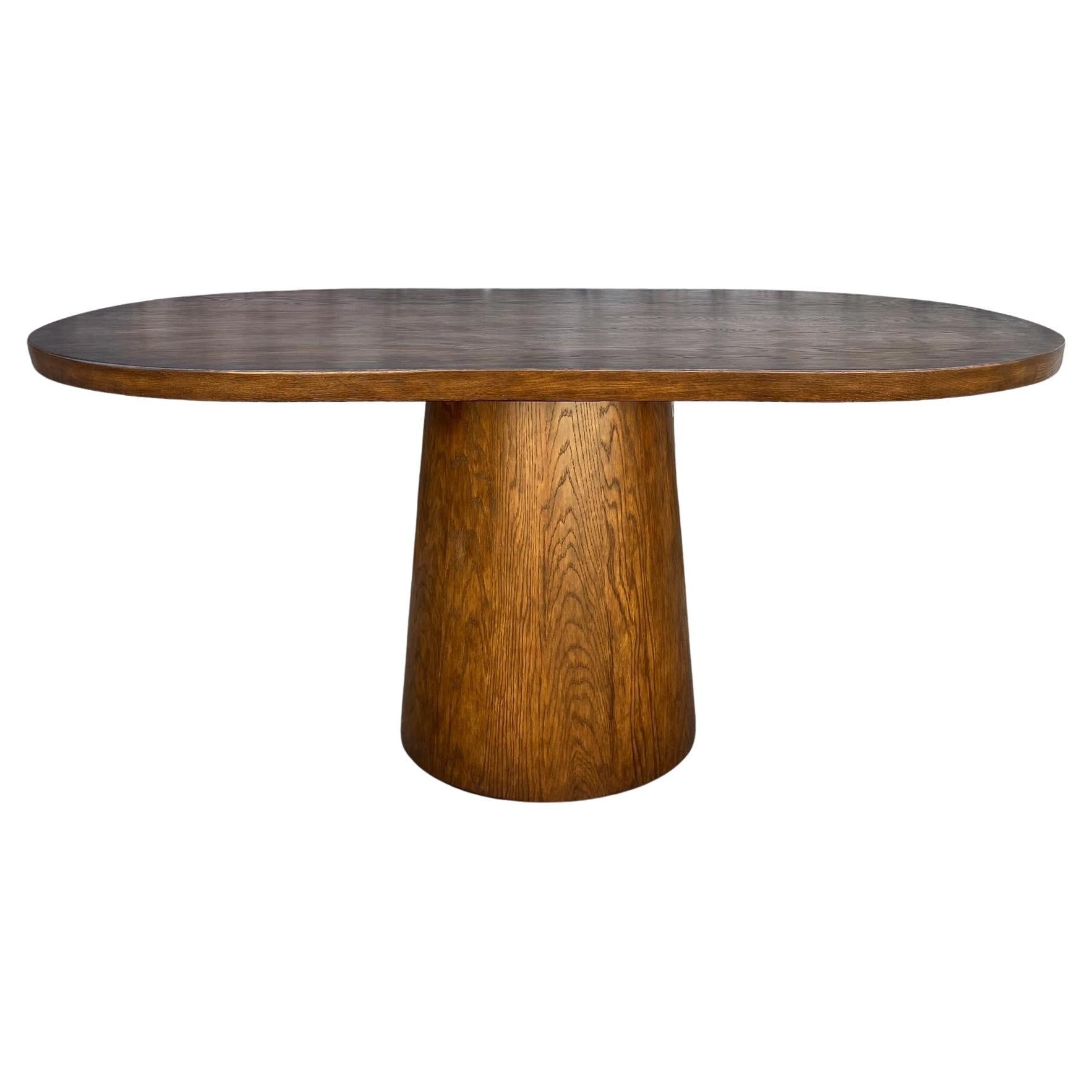 https://a.1stdibscdn.com/dos-gallos-custom-oak-oval-top-table-with-tapered-base-for-sale/f_7978/f_404113621719781146825/f_40411362_1719781147192_bg_processed.jpg
