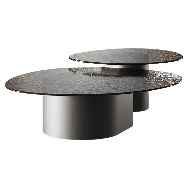 https://a.1stdibscdn.com/fusion-glass-nested-coffee-tables-with-fluted-bronze-base-for-sale-picture-2/f_27693/f_489138321771622991073/f_41268822_1725002651719_bg_processed.jpg