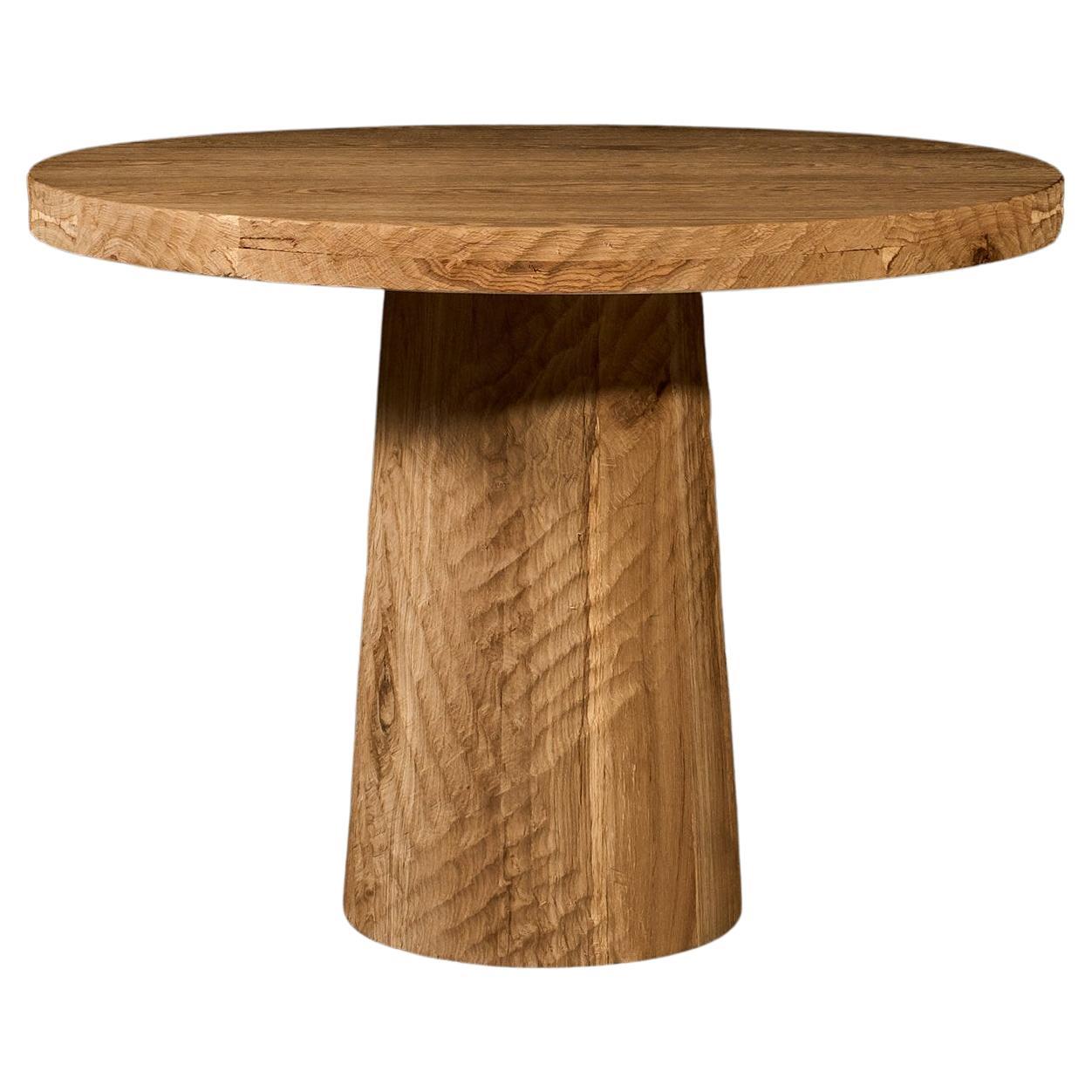 https://a.1stdibscdn.com/vintage-brutalist-style-sculpted-round-table-in-aged-oak-140cm-for-sale/f_99712/f_413378621725520288499/f_41309192_1725309639365_bg_processed.jpg