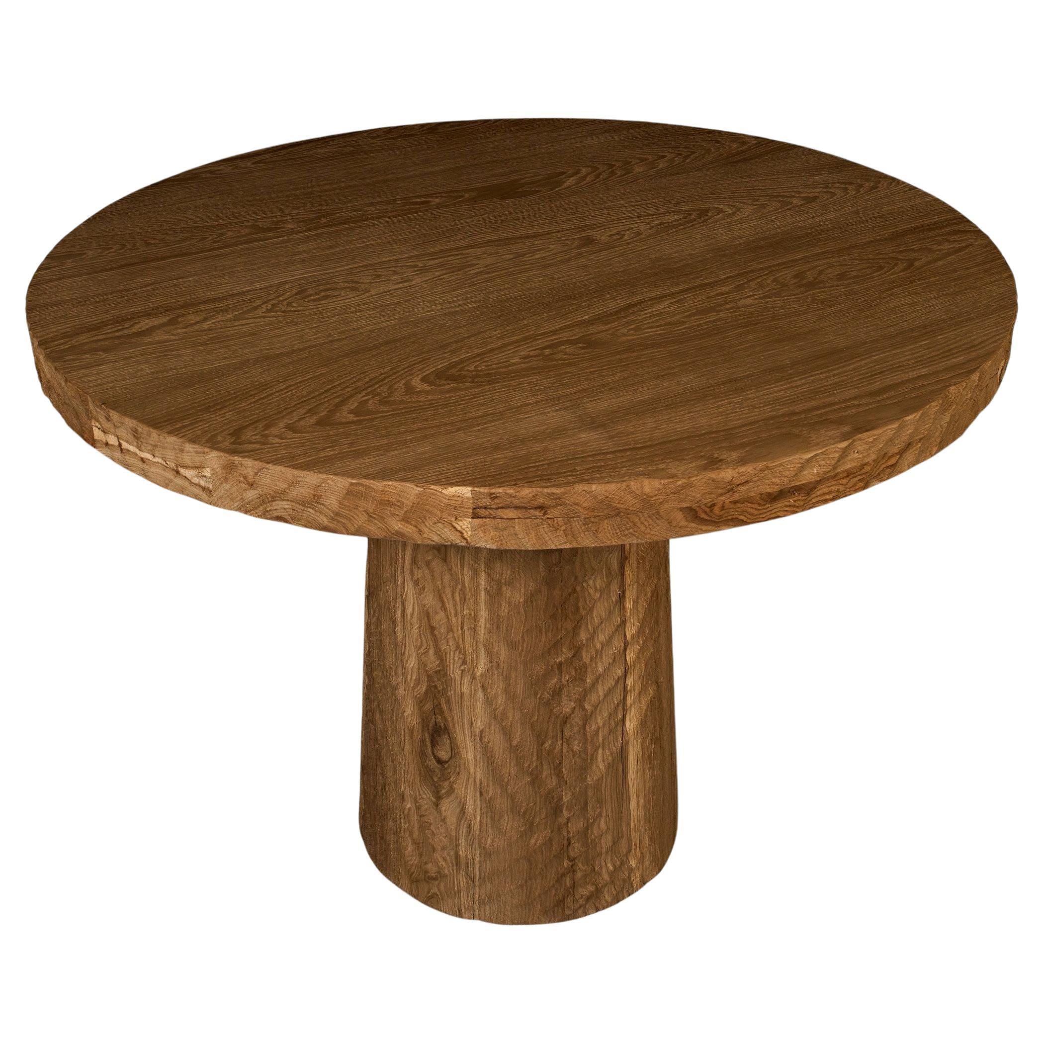 https://a.1stdibscdn.com/vintage-brutalist-style-sculpted-round-table-in-aged-oak-140cm-for-sale/f_99712/f_413378621739140940127/f_41337862_1739140940750_bg_processed.jpg
