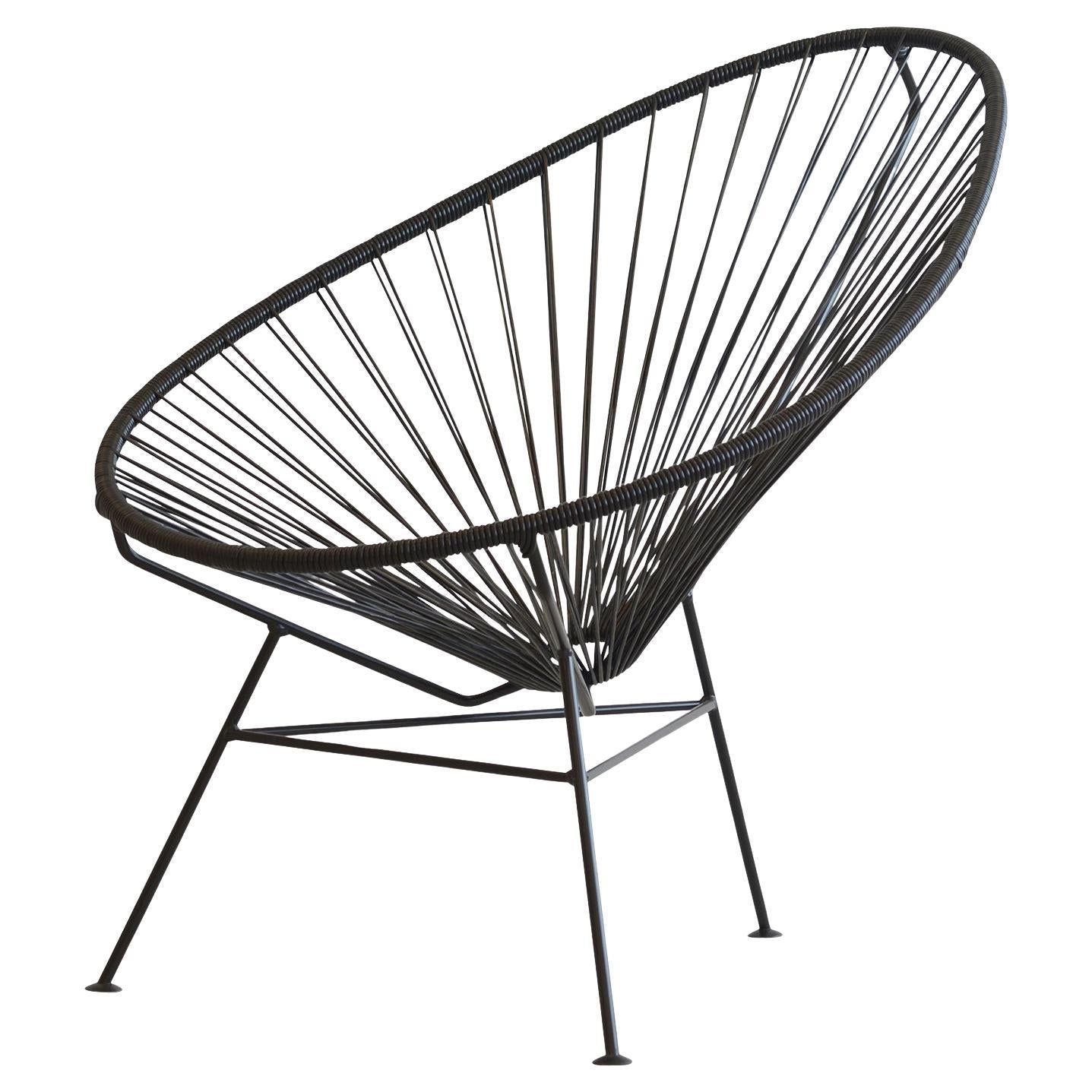 https://a.1stdibscdn.com/black-acapulco-chair-by-ok-design-for-sale/f_12192/f_414526421726176650200/f_41452642_1726176650527_bg_processed.jpg
