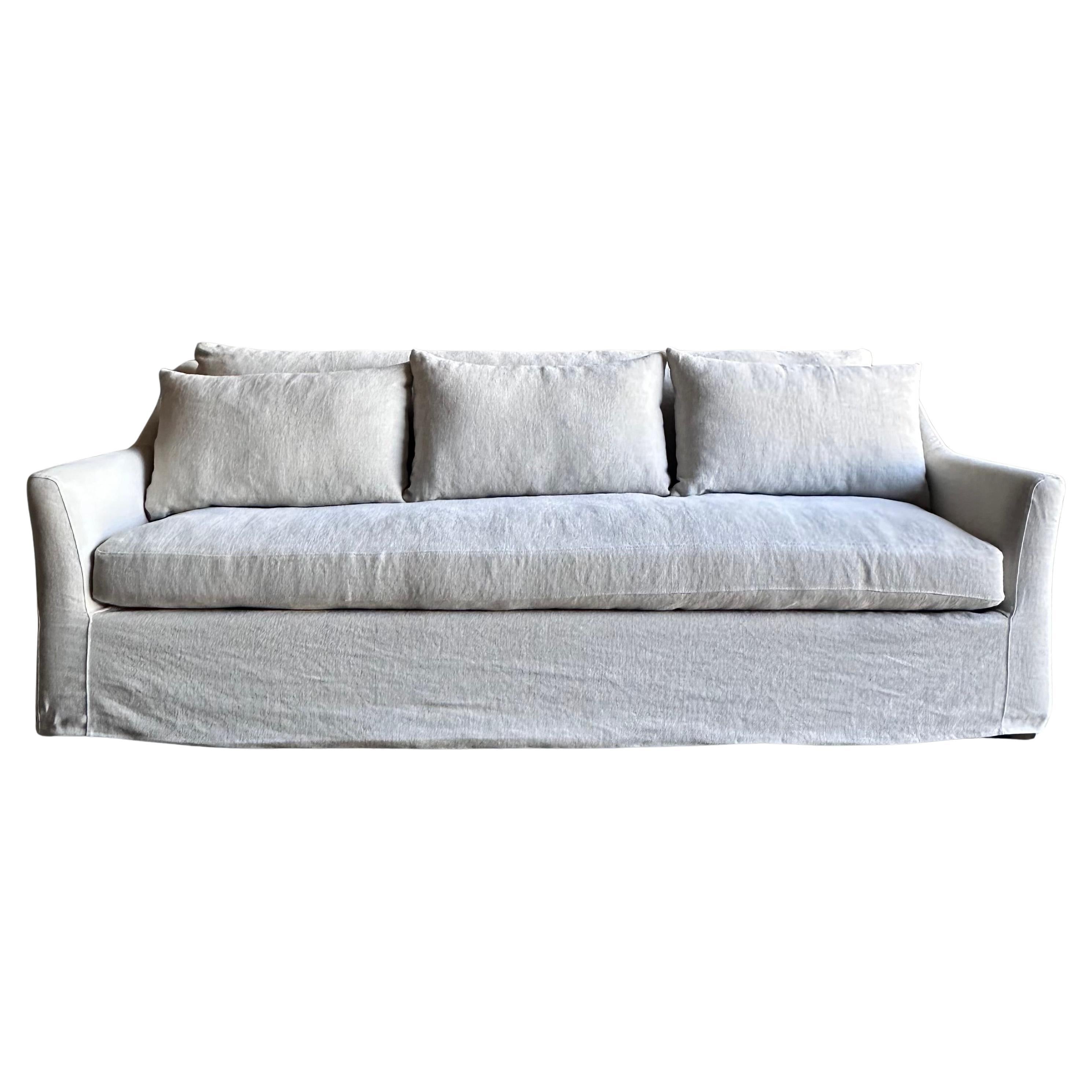 https://a.1stdibscdn.com/slip-covered-slope-arm-sofa-in-stone-washed-greige-linen-with-down-cushions-for-sale/f_18223/f_418252121728502058106/f_41825212_1728502059033_bg_processed.jpg
