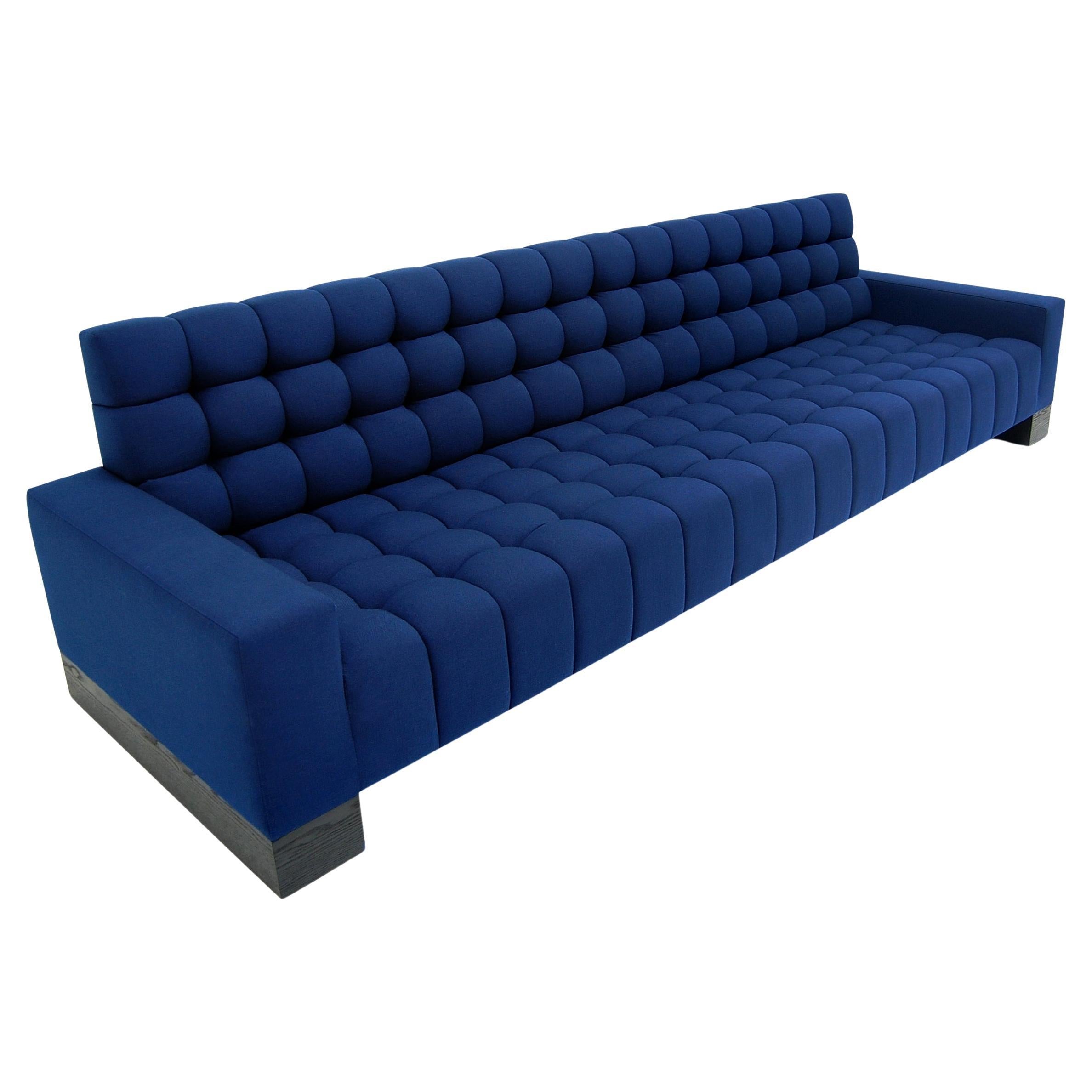 https://a.1stdibscdn.com/abyss-sofa-channeling-deep-tufted-wood-block-base-blue-custom-for-sale/f_31463/f_420063321729698801828/f_42006332_1729698802688_bg_processed.jpg