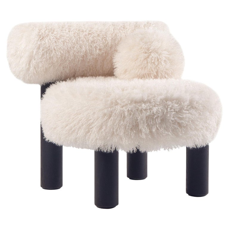 https://a.1stdibscdn.com/modern-low-chair-gropius-cs2-fluffy-in-azur-faux-fur-with-wooden-legs-by-noom-for-sale/f_42321/f_422472121731182194045/f_42247212_1731182194863_bg_processed.jpg?width=768