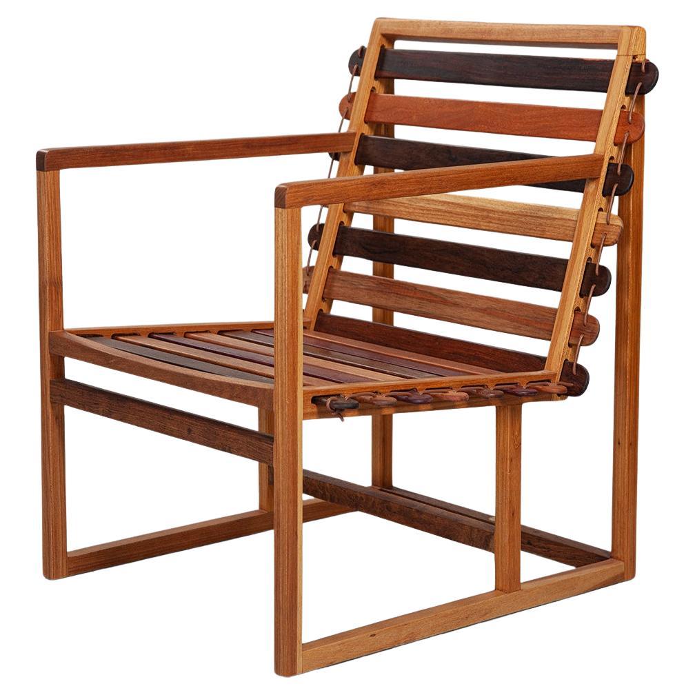 https://a.1stdibscdn.com/vino-armchair-made-from-various-brazilian-woods-showroom-sample-for-sale/f_88362/f_488214521771182800099/f_43523652_1738931697675_bg_processed.jpg