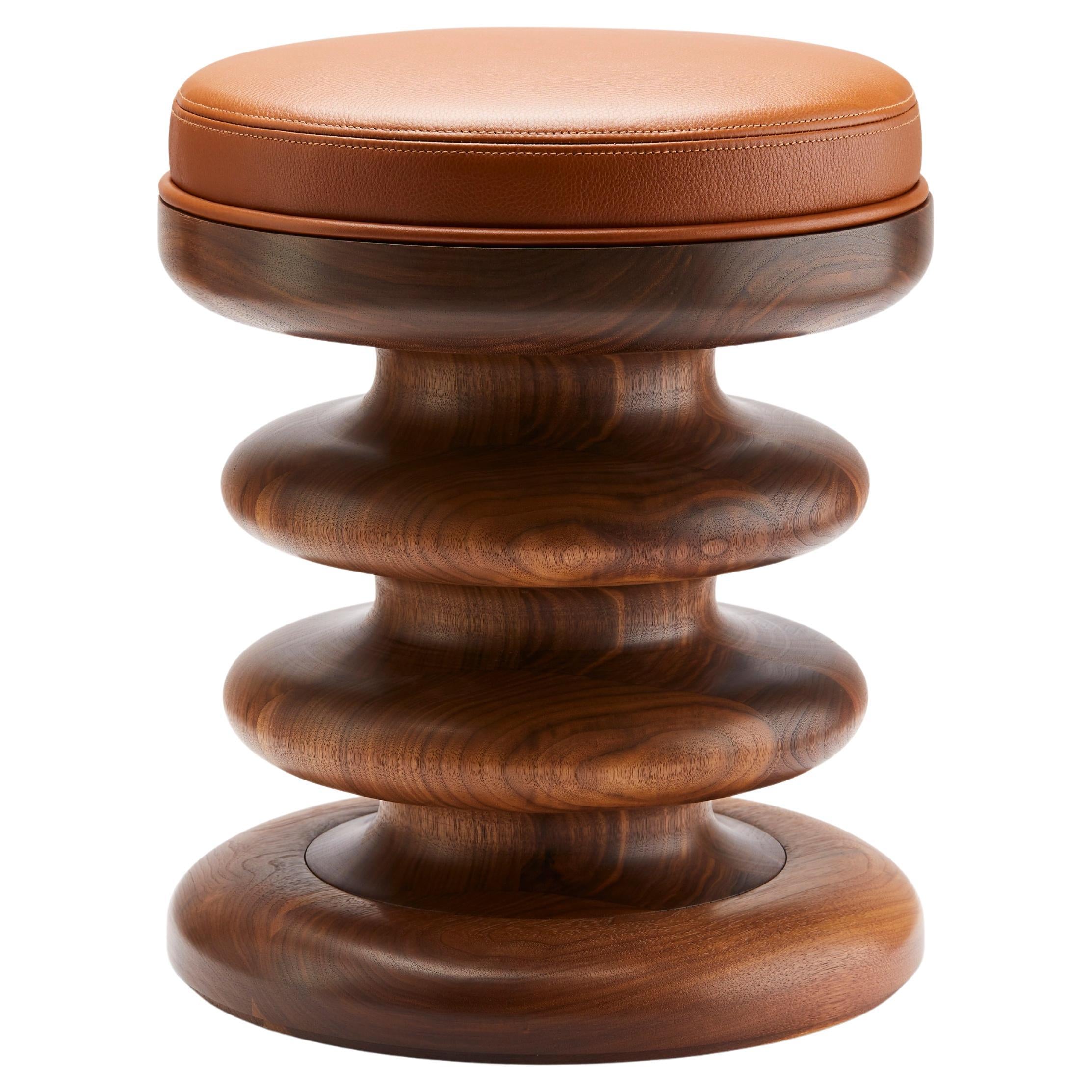 https://a.1stdibscdn.com/contemporary-vertere-midi-stool-in-oiled-walnut-with-chestnut-leather-seat-pad-for-sale/f_27813/f_470395521760449710339/f_43710002_1740749883618_bg_processed.jpg