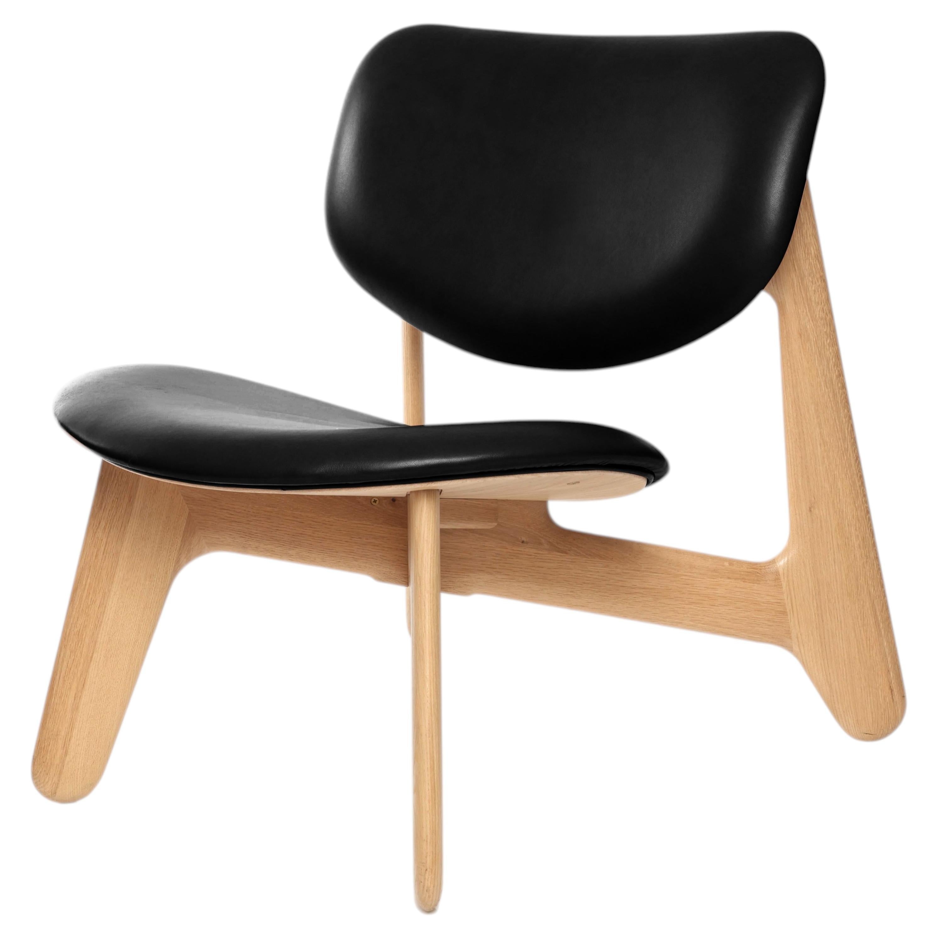 https://a.1stdibscdn.com/tom-dixon-natural-oak-wood-and-black-leather-slab-lounge-chair-for-sale/f_14472/f_438973421771887746104/f_43897342_1771887746511_bg_processed.jpg