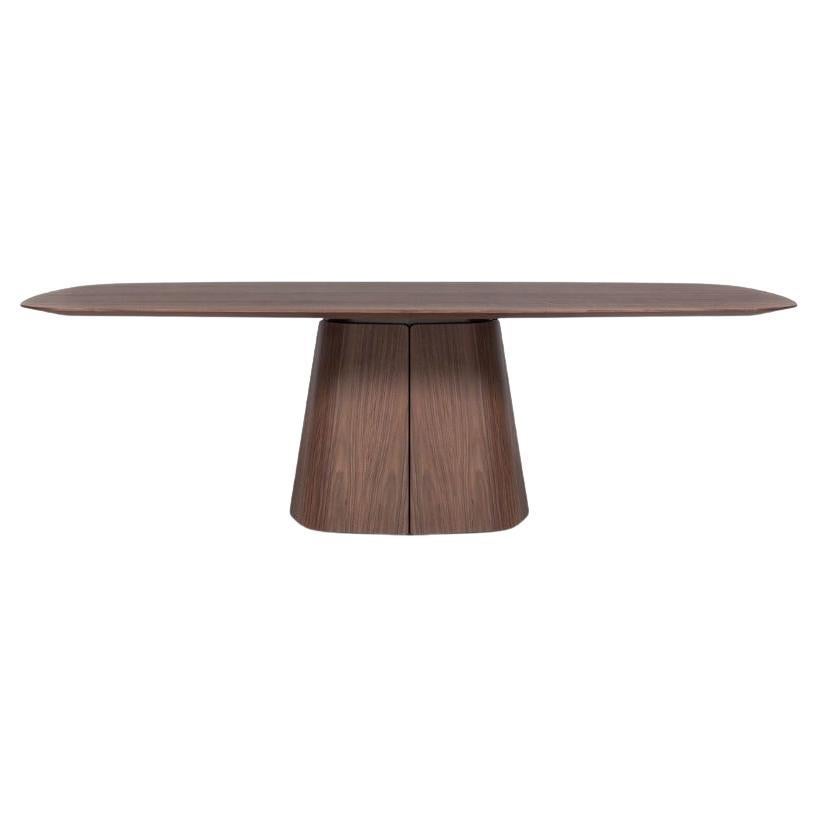 https://a.1stdibscdn.com/sculptural-solid-walnut-dining-table-with-tapered-plinth-base-for-sale/f_27693/f_449861421747086341712/f_44986142_1747086341823_bg_processed.jpg