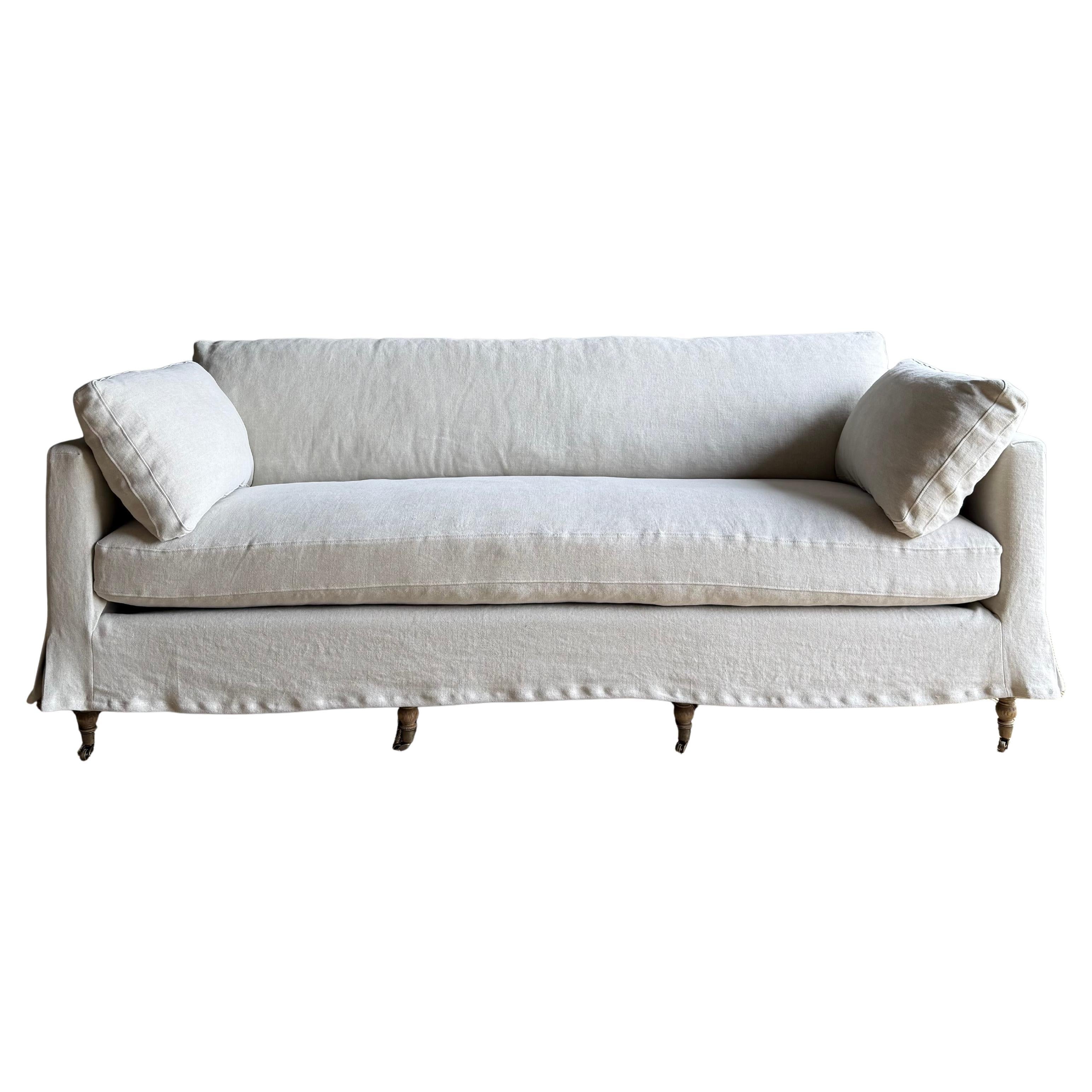 https://a.1stdibscdn.com/rudin-slip-covered-stone-washed-linen-sofa-with-down-cushions-for-sale/f_18223/f_453499621749244316172/f_45349962_1749244317363_bg_processed.jpg