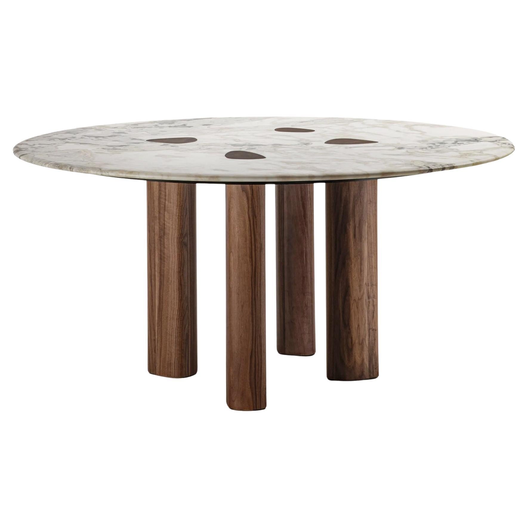 https://a.1stdibscdn.com/marbelesa-walnut-round-dining-table-for-sale/f_14282/f_461877421754656532007/f_46187742_1754656532408_bg_processed.jpg