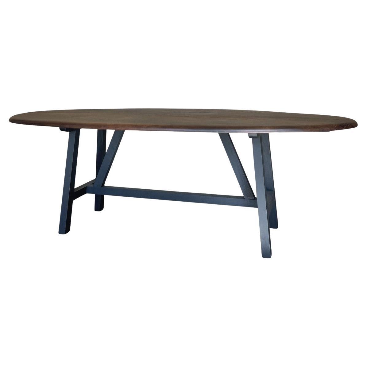 https://a.1stdibscdn.com/custom-walnut-2-plank-top-oval-dining-table-model-lusi-dark-finish-for-sale/f_20233/f_470116321760210063499/f_47011632_1760210063696_bg_processed.jpg