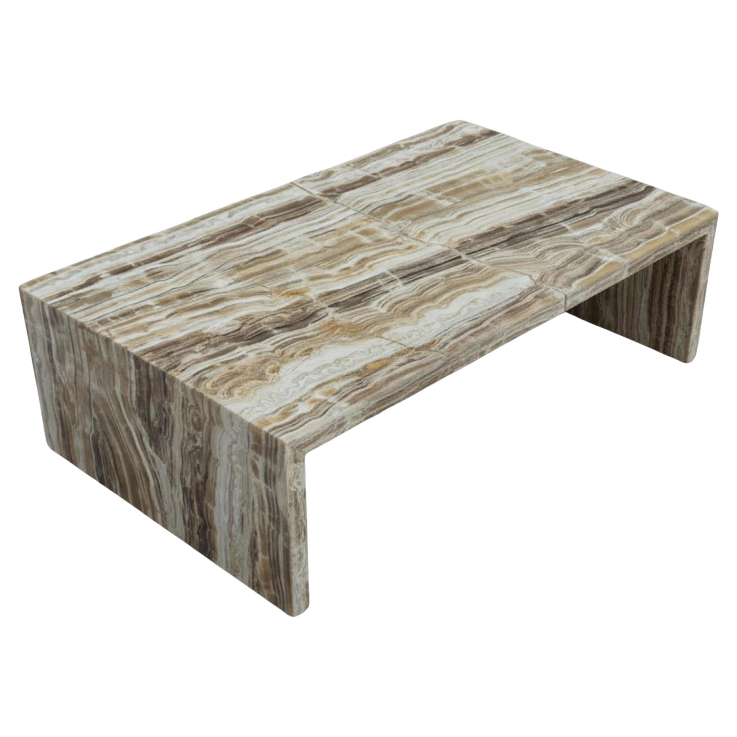 https://a.1stdibscdn.com/sculptural-waterfall-onyx-marble-coffee-table-waterfall-marble-table-for-sale/f_91932/f_472831821761823926474/f_47283182_1761823927233_bg_processed.jpg