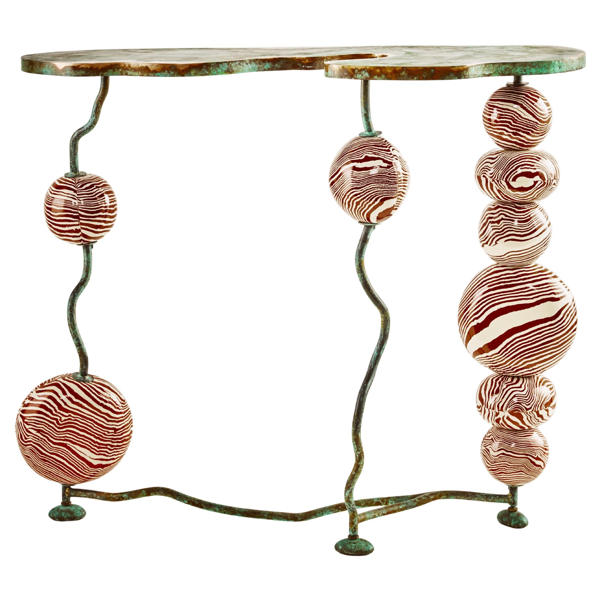 https://a.1stdibscdn.com/henry-holland-studio-stratus-bronze-and-ceramic-console-table-for-sale/f_82792/f_474976721762964076815/f_47497672_1762964077597_bg_processed.jpg