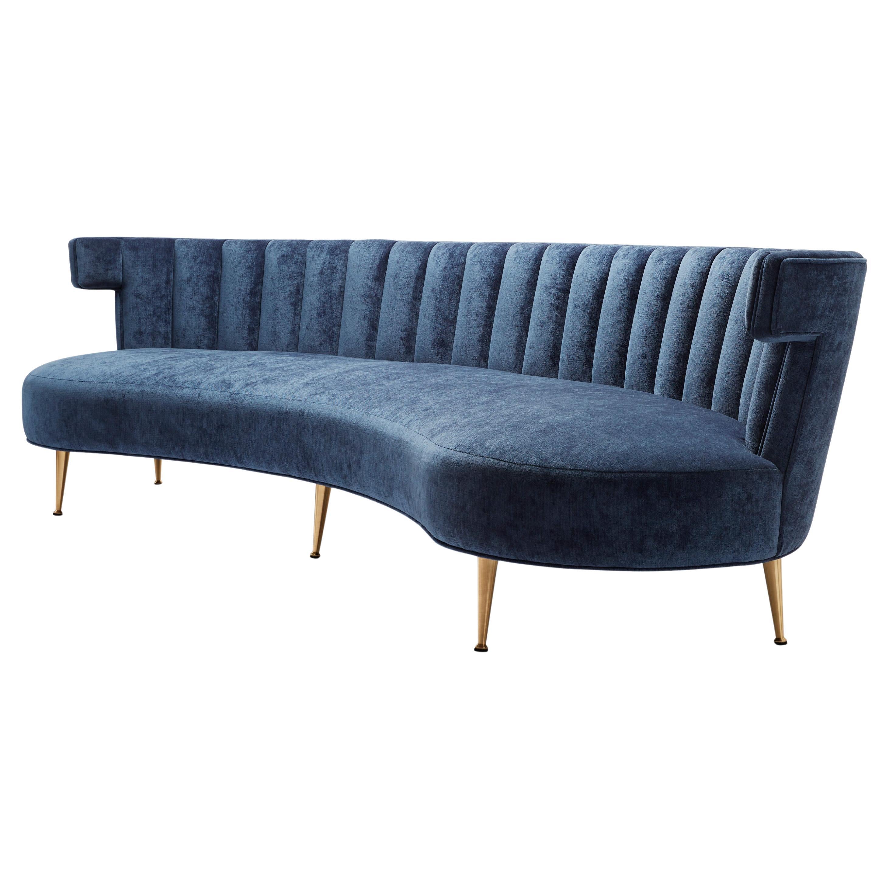 https://a.1stdibscdn.com/isabella-super-curve-sofa-in-denim-blue-velvet-brass-legs-for-sale/f_27813/f_477361921764268964755/f_47736192_1764268965689_bg_processed.jpg