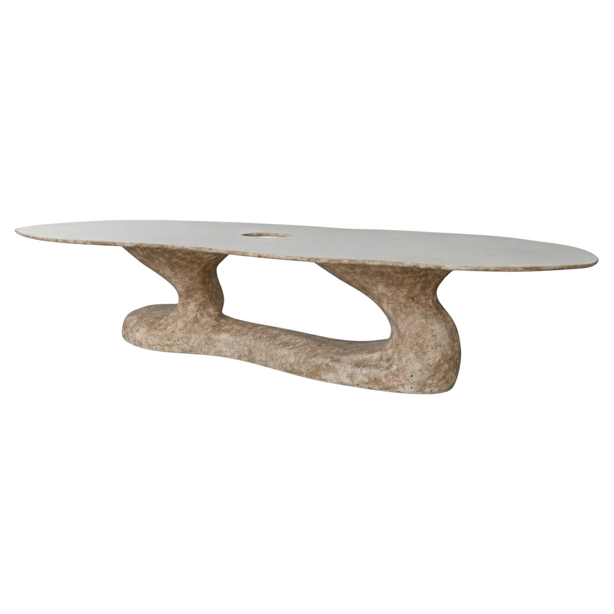 https://a.1stdibscdn.com/hand-sculpted-oval-dining-table-for-indoor-and-outdoor-use-for-sale/f_27693/f_485274721769547783602/f_48527472_1769547784010_bg_processed.jpg