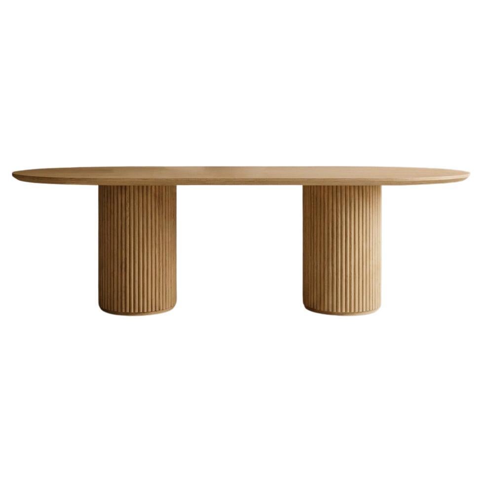 https://a.1stdibscdn.com/ashi-dining-table-minimal-sculptural-oak-dining-table-for-sale/f_102612/f_488577921771341401875/f_48857792_1771341402044_bg_processed.jpg