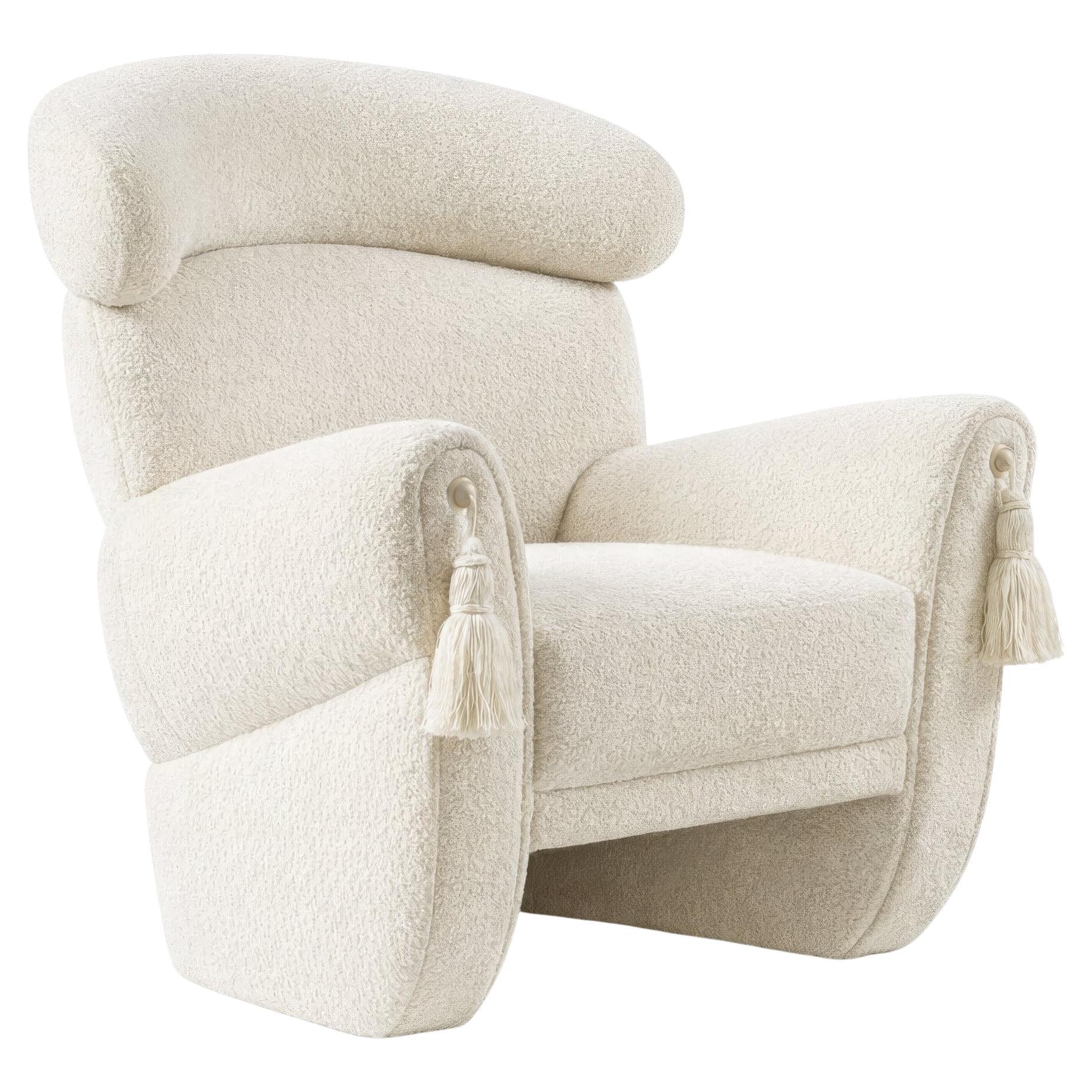 https://a.1stdibscdn.com/hollywood-regency-curved-armchair-in-boucle-with-decorative-tassel-arm-details-for-sale/f_27693/f_490920721772746813550/f_49092072_1772746814173_bg_processed.jpg