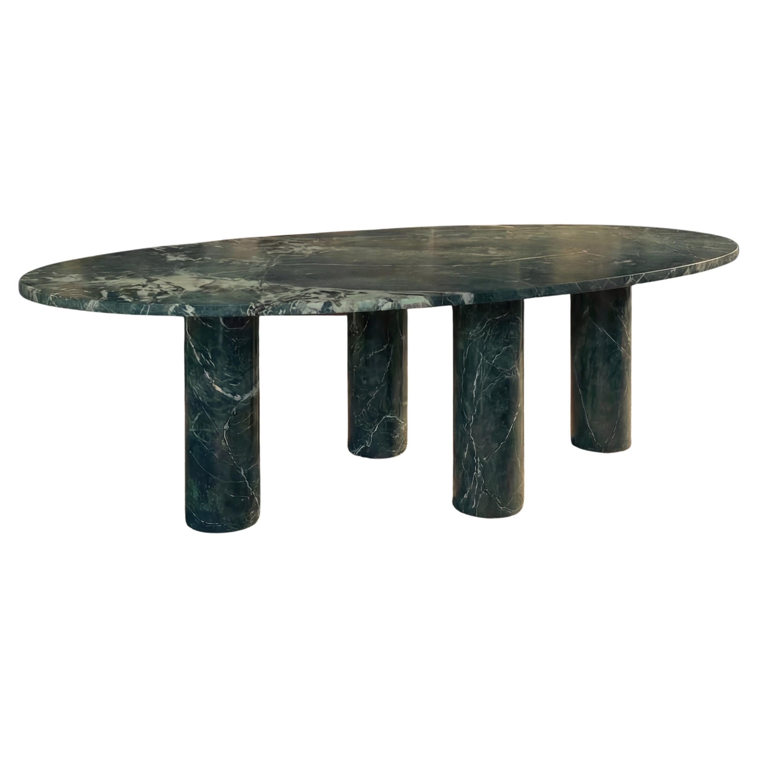 https://a.1stdibscdn.com/large-dark-green-marble-oval-dining-table-with-mario-bellini-style-column-legs-for-sale/f_80522/f_491504321773091341686/f_49150432_1773091342339_bg_processed.jpg