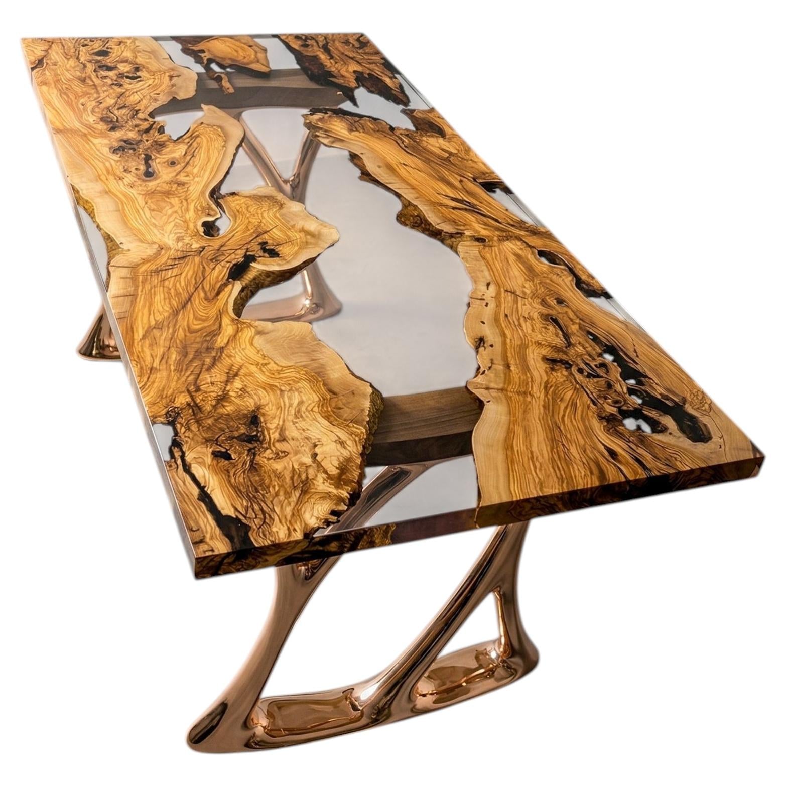 https://a.1stdibscdn.com/aluminium-casting-legs-with-olive-wood-crystal-clear-epoxy-resin-dining-table-for-sale/f_91932/f_495752221775652529686/f_49575222_1775652529818_bg_processed.jpg